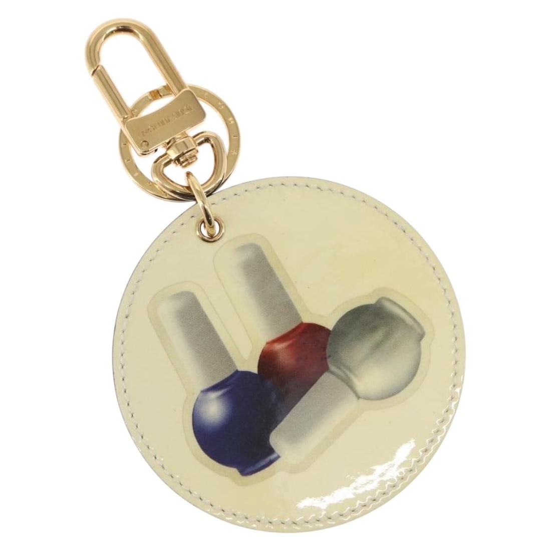 Beige Patent Leather Nail Polish Charm MP1570 by Louis Vuitton: Beige Patent Leather Nail Polish Charm MP1570 by Louis Vuitton This is a Louis Vuitton Illustre Nail Polish Charm crafted from beige patent leather with gold-tone metal accents. Designed as a decorati