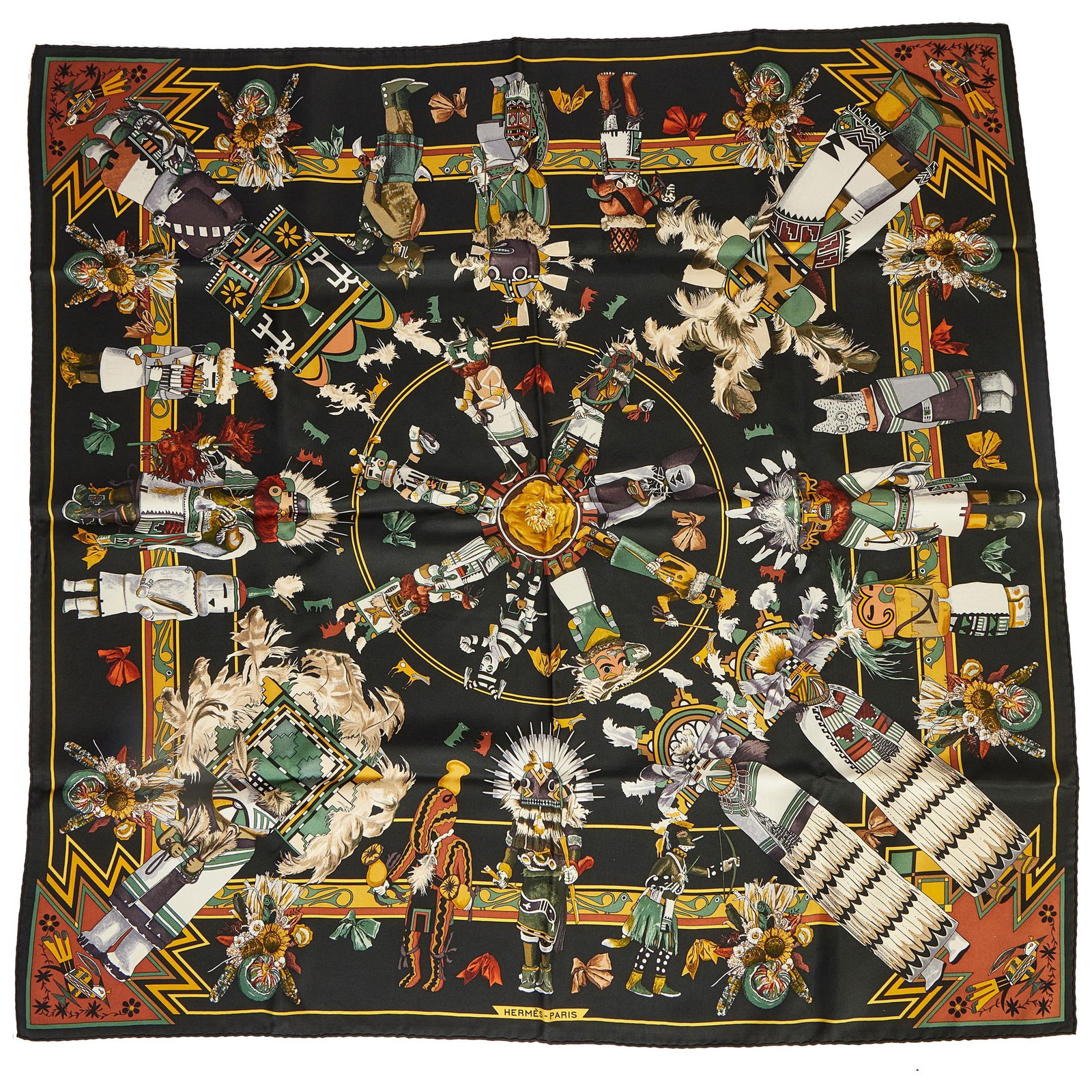 Hermes Kachinas Silk Scarf by Kermit Oliver 35 in Black Brown: Hermes Kachinas Silk Scarf by Kermit Oliver 35 in Black Brown Elevate your style with the exquisite Hermes Kachinas silk scarf, designed by the renowned artist Kermit Oliver. This luxurious scarf feat