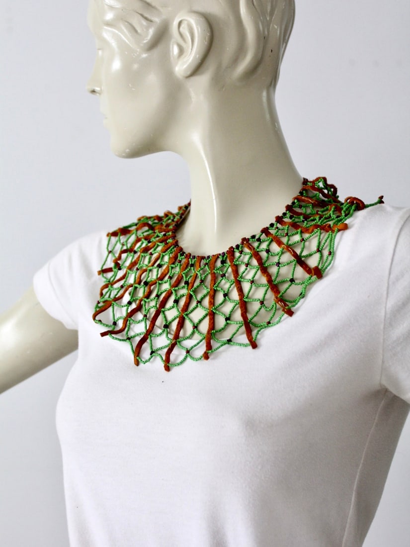 Boho Vintage Beaded Collar Necklace with Leather Ties: Boho Vintage Beaded Collar Necklace with Leather Ties Add a touch of vintage charm with this boho beaded collar necklace. Crafted with a delightful combination of little green beads, tan leather, and