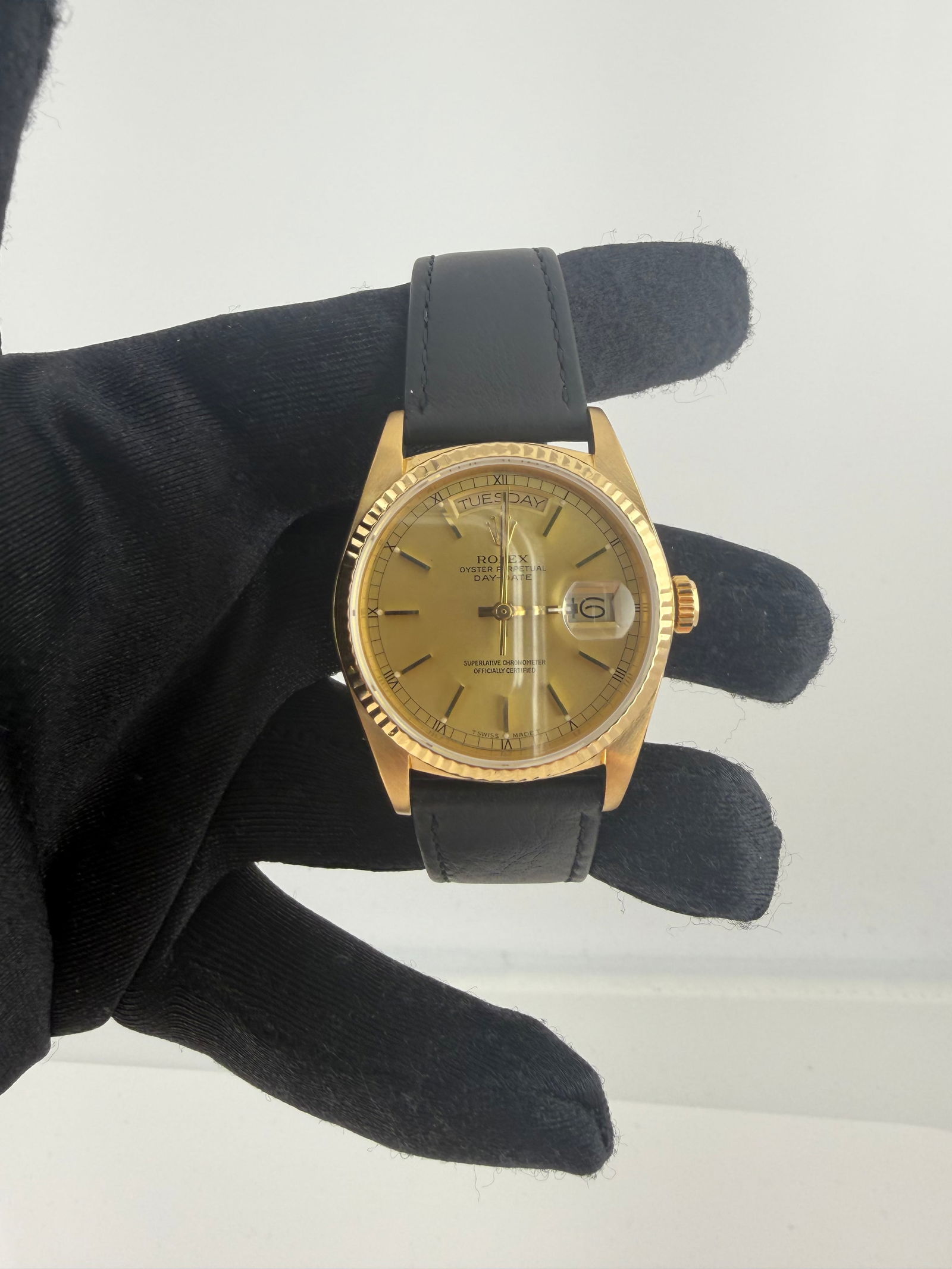 Day Date Reference 18038 Watch with Gold Dial and OG Leather Strap: Day Date Reference 18038 Watch with Gold Dial and OG Leather Strap This Rolex Day Date features a gold dial, fluted bezel, and is paired with an original leather bracelet. The watch is designed for me