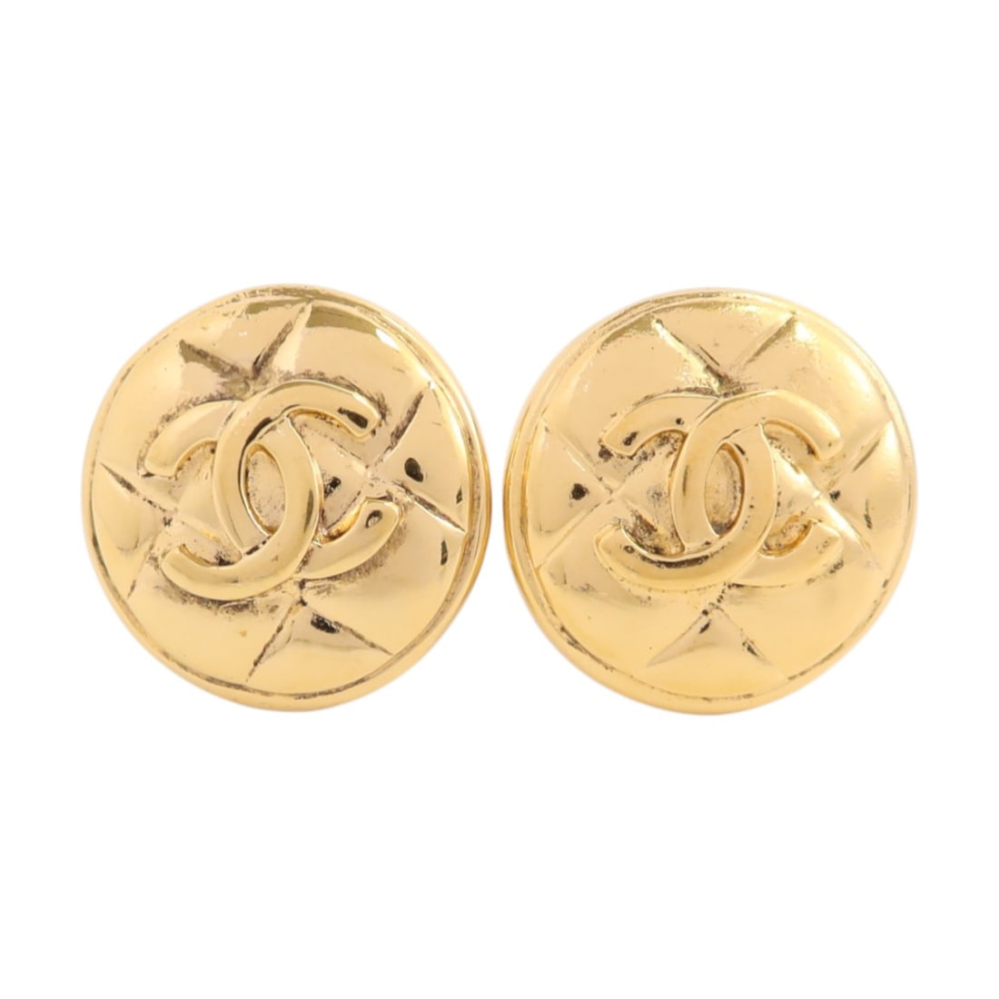 Vintage CHANEL Gold Tone Earrings with CC Logo: Vintage CHANEL Gold Tone Earrings with CC Logo These vintage CHANEL earrings feature the iconic CC logo in a gold-tone metal. Made in France, they showcase a classic design without any stones and disp