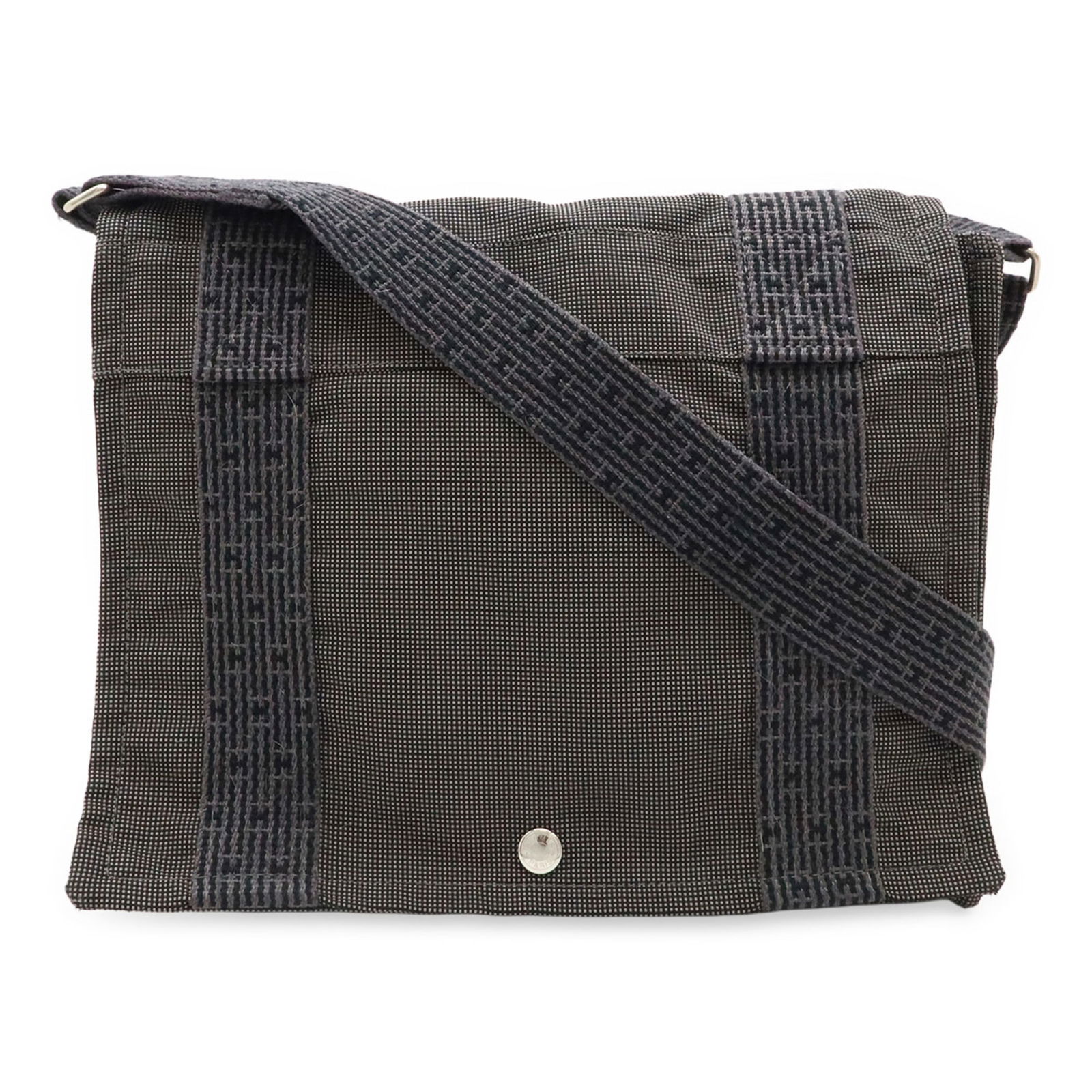 Grey Canvas Herline Bag by Hermes France: Grey Canvas Herline Bag by Hermes France This Hermes Herline bag is crafted from grey canvas and features a practical, unisex design. It was made in France and has spacious dimensions, making it suita