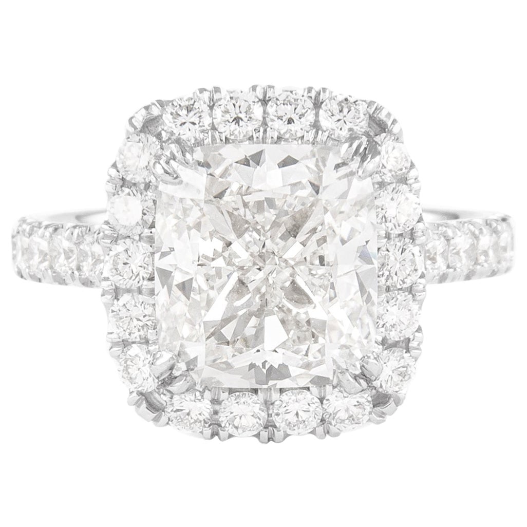4.01 Carat H VS1 Cushion Diamond Halo Ring in 18K White Gold: 4.01 Carat H VS1 Cushion Diamond Halo Ring in 18K White Gold This exquisite engagement ring features a stunning 4.01 carat cushion-cut diamond with an EGL certification, showcasing a beautiful H color