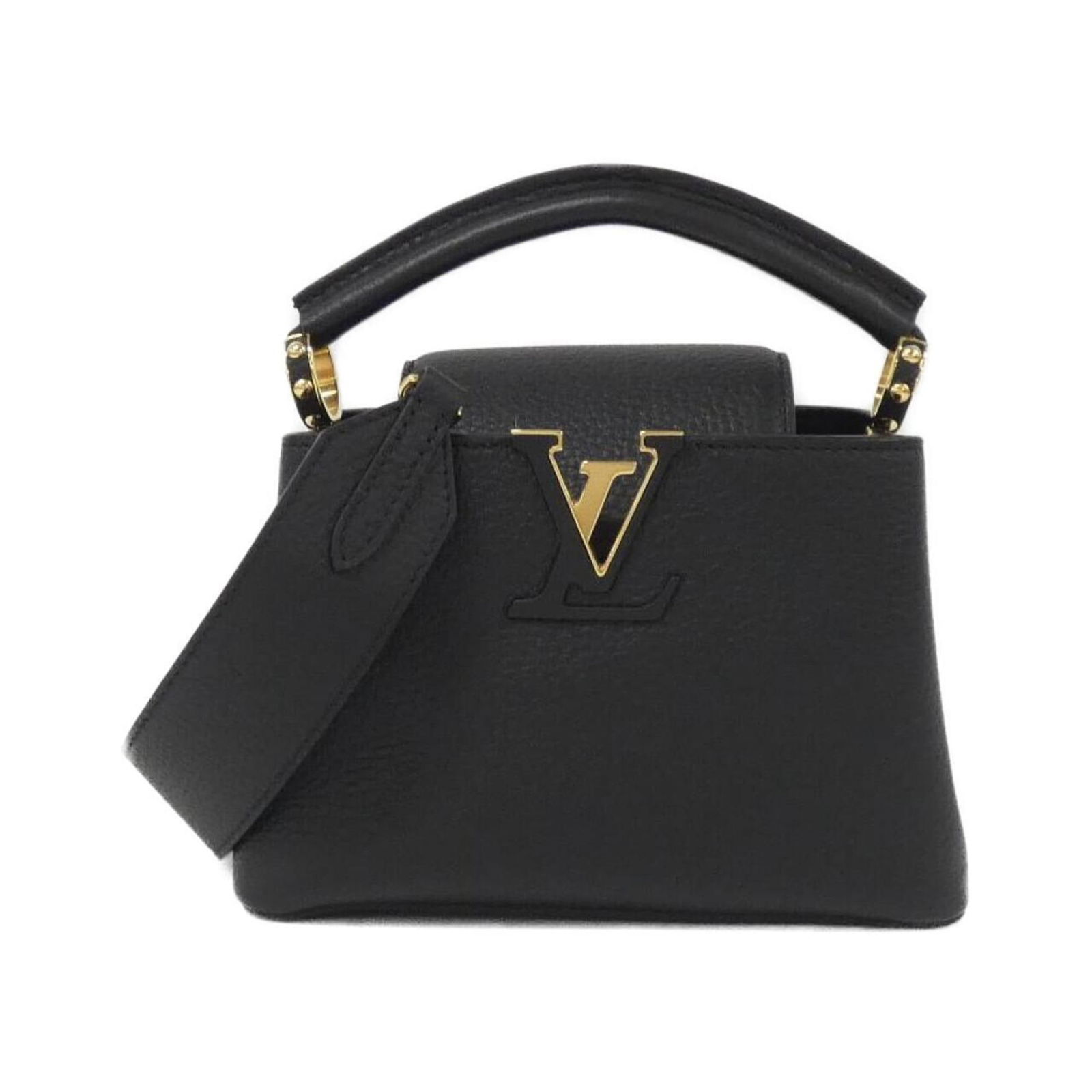 Black Leather Louis Vuitton Capucines Mini Bag: Black Leather Louis Vuitton Capucines Mini Bag The Louis Vuitton Capucines Mini is a sophisticated handbag crafted from black leather. Designed for women, this bag features a compact silhouette and is