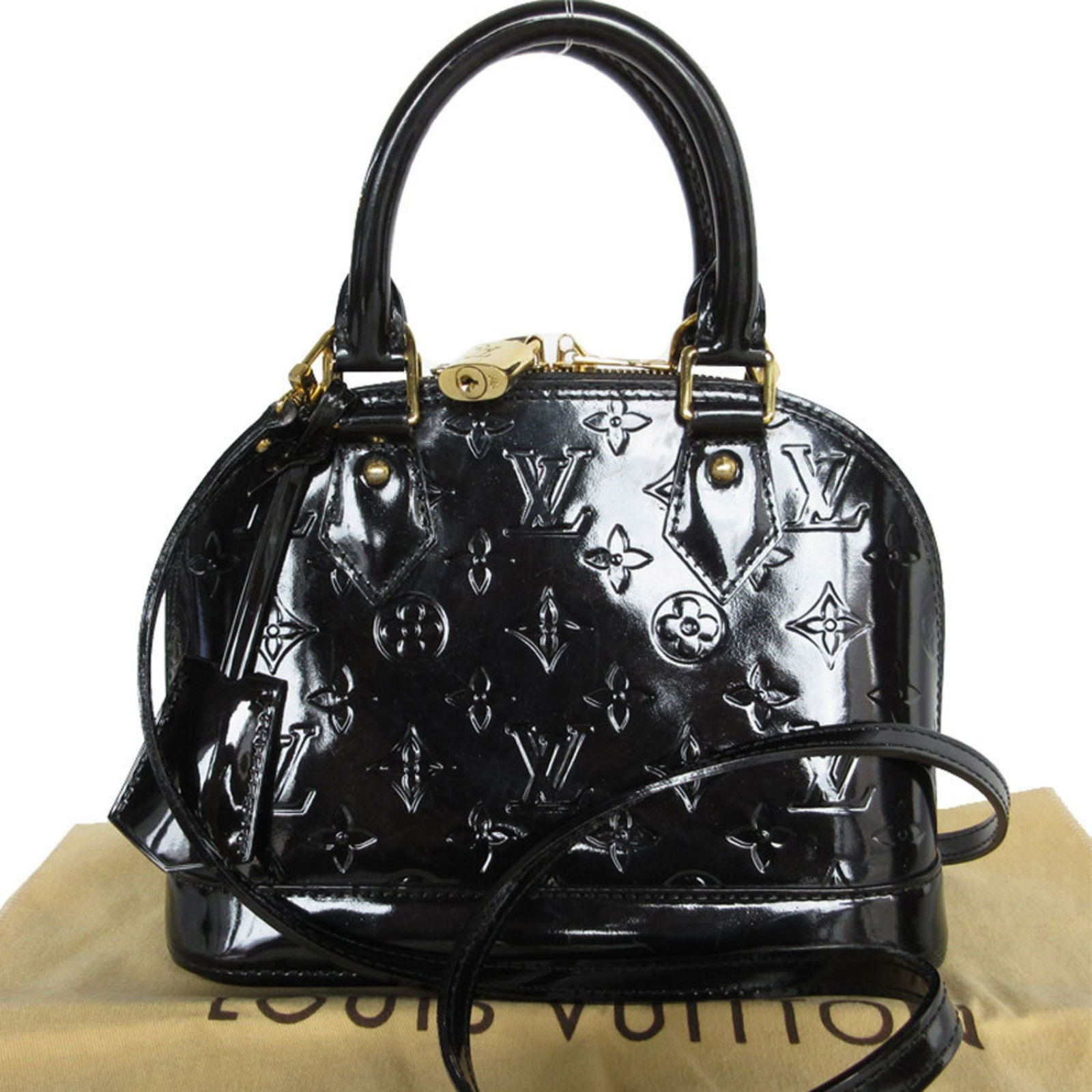 Black Patent Leather Alma BB by Louis Vuitton Satchel Handbag: Black Patent Leather Alma BB by Louis Vuitton Satchel Handbag This Louis Vuitton Alma BB is crafted in black patent leather and features a compact, structured silhouette. The bag displays traces of us