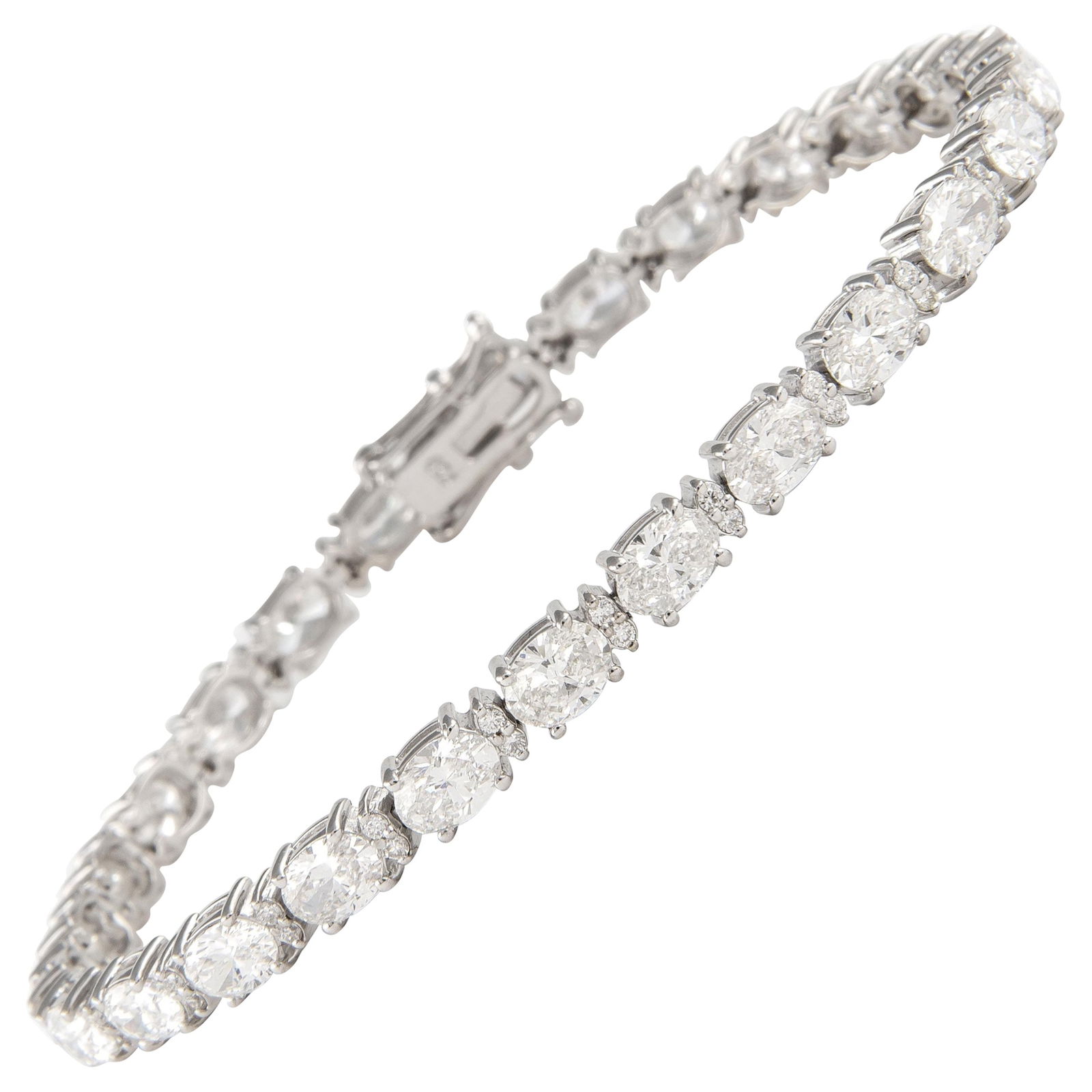 8.76ct Oval Diamond Tennis Bracelet 18k White Gold: 8.76ct Oval Diamond Tennis Bracelet 18k White Gold This exquisite 8.76ct Oval Diamond East-West Tennis Bracelet showcases a stunning contemporary design crafted in 18k white gold. The bracelet feature
