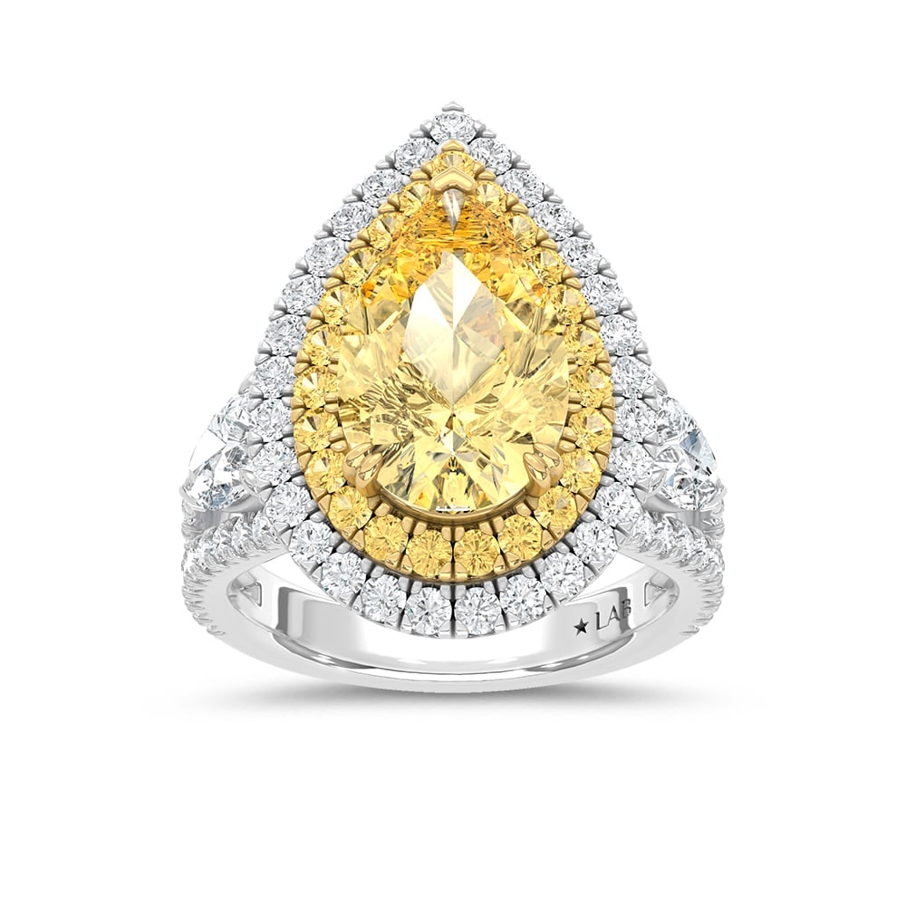 14K Two Tone Lab Grown Diamond 7 3/4 Ct.Tw. Yellow Pear Engagement Ring (Center 5 ct): 14K Two Tone Lab Grown Diamond 7 3/4 Ct.Tw. Yellow Pear Engagement Ring (Center 5 ct) Make a statement of grandeur with this 14K Two-Tone Gold Engagement Ring, featuring a breathtaking 5-carat lab-gro
