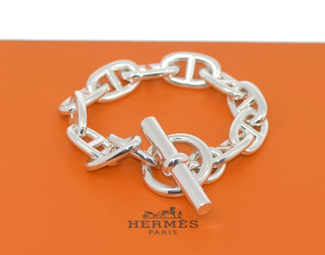 Sterling Silver 8.5 Inch Chaine d'Ancre Bracelet by Hermes with Box: Sterling Silver 8.5 Inch Chaine d'Ancre Bracelet by Hermes with Box This Hermes Chaine d'Ancre bracelet is crafted from 925 sterling silver in a classic chain style. The bracelet does not feature any