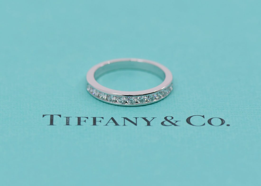 Tiffany & Co Platinum Diamond Wedding Band 0.33 CTW Size 5.5: Tiffany & Co Platinum Diamond Wedding Band 0.33 CTW Size 5.5 This exquisite Tiffany & Co. wedding band ring is crafted from high-quality platinum, boasting a metal purity of 950. With a total diamond
