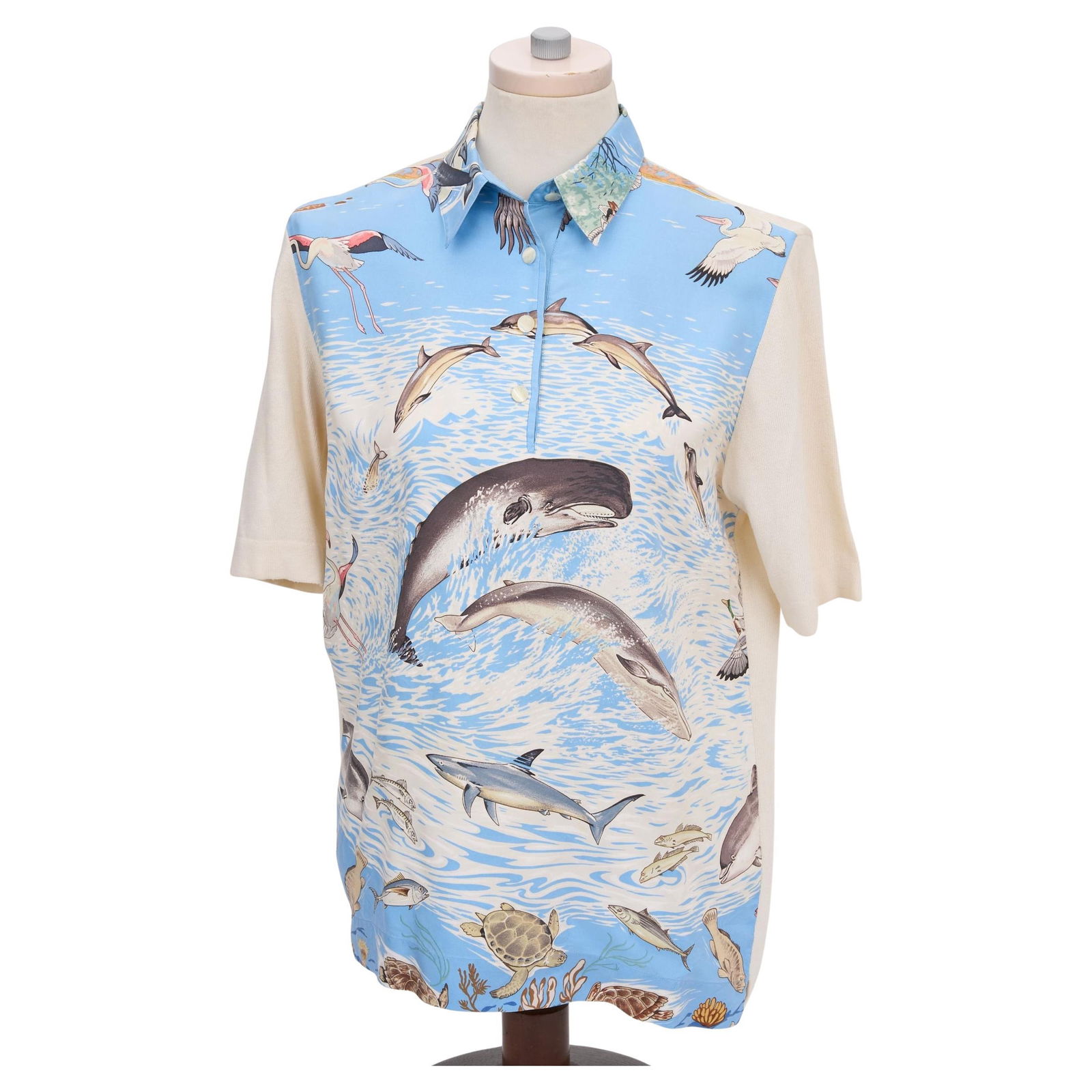Hermes Celeste Dolphins Silk Polo Cashmere Sleeve Size S: Hermes Celeste Dolphins Silk Polo Cashmere Sleeve Size S This exquisite Hermes Celeste Dolphins Silk Print Polo showcases a vibrant sea life print, perfect for adding a touch of elegance to your wardr