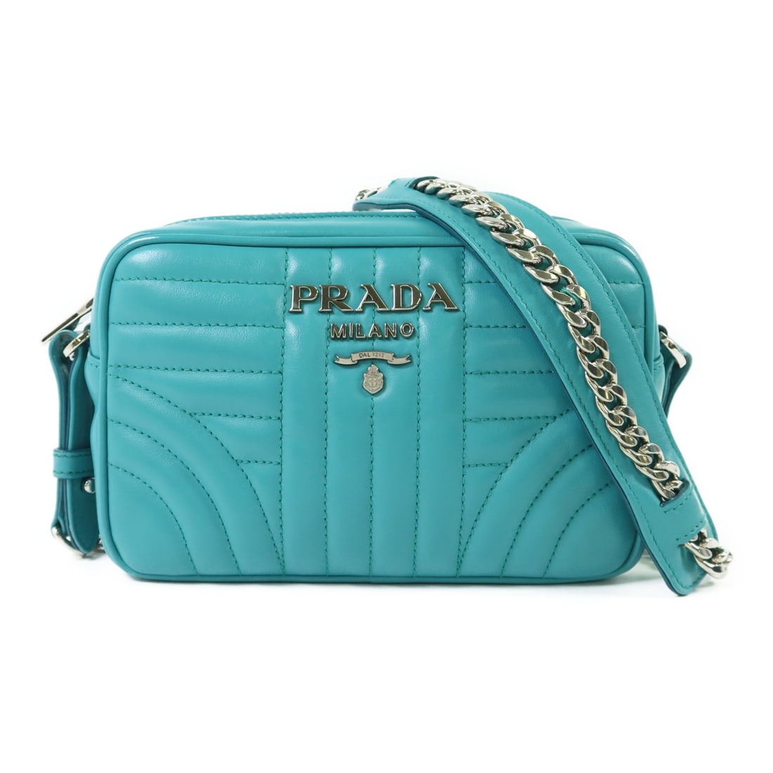 Blue Calfskin Leather Prada Camera Shoulder Bag with Silver Chain: Blue Calfskin Leather Prada Camera Shoulder Bag with Silver Chain This PRADA shoulder bag is crafted from blue calfskin leather and features a compact camera bag design. It is accented with silver-ton