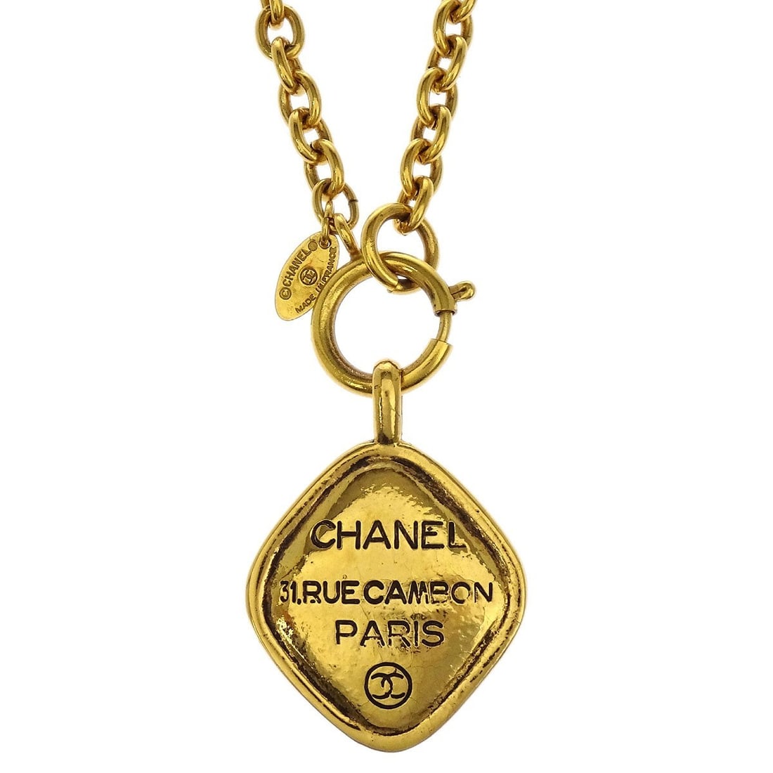 Gold Plated Pendant Necklace with Rhombus Chain by Chanel: Gold Plated Pendant Necklace with Rhombus Chain by Chanel This Chanel necklace features a rhombus-shaped pendant on a gold-plated chain. The elegant pendant style and signature gold finish combine for