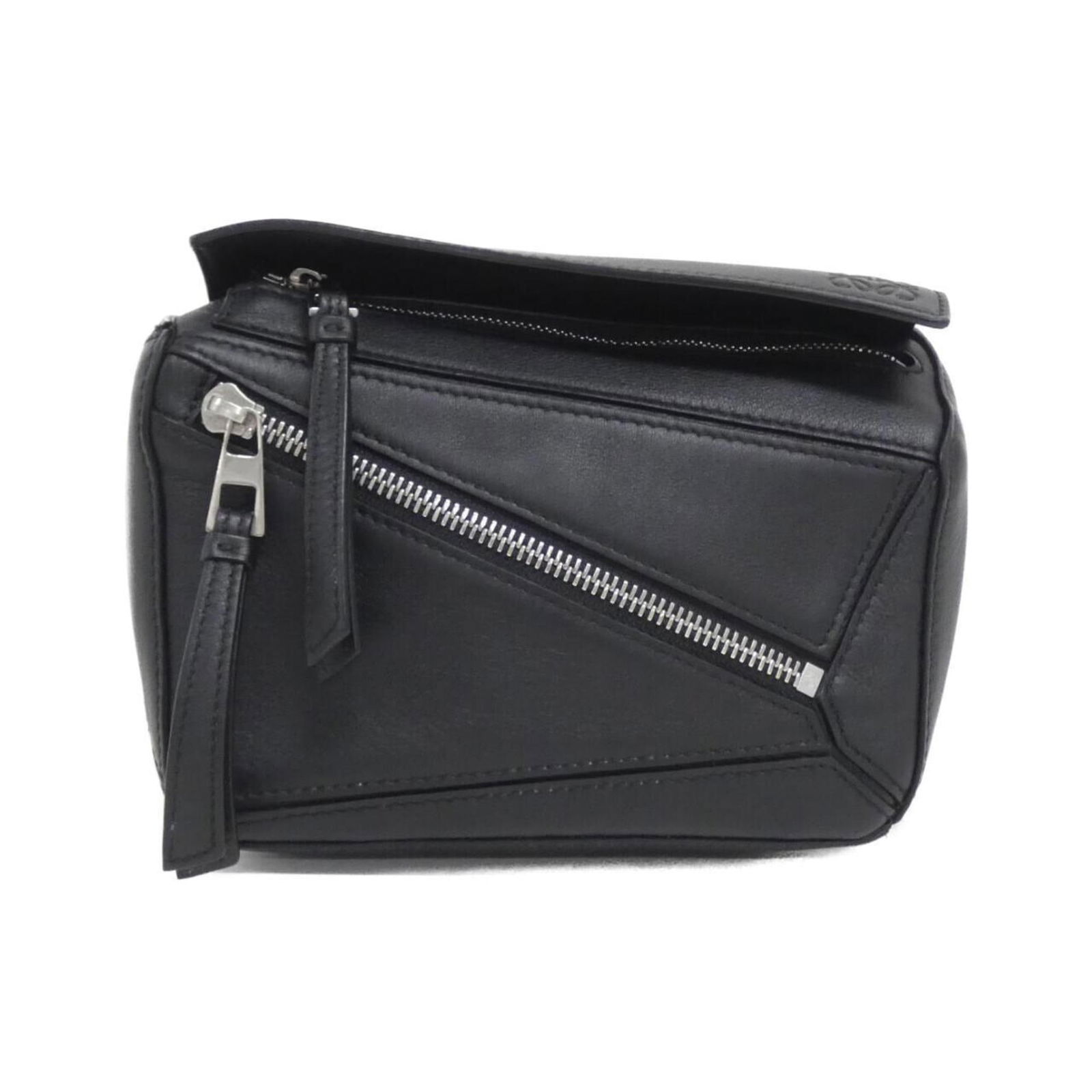 Loewe Black Leather Puzzle Shoulder Bag with Adjustable Strap: Loewe Black Leather Puzzle Shoulder Bag with Adjustable Strap This Loewe Puzzle bag features a black leather exterior with a structured silhouette. Designed for women, it offers versatile carrying opt