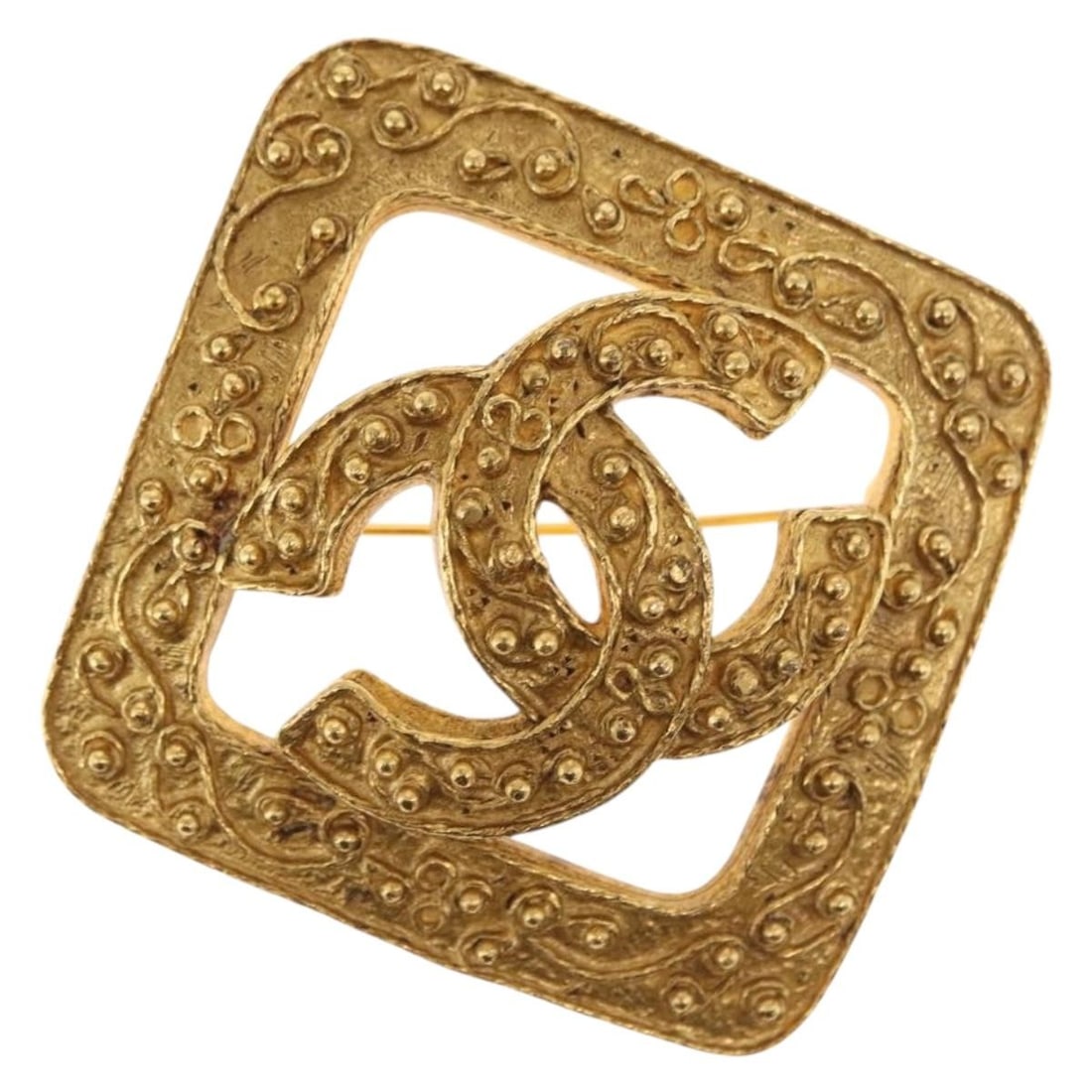 Gold Tone Metal Brooch by CHANEL CC Logo France 60mm: Gold Tone Metal Brooch by CHANEL CC Logo France 60mm This CHANEL brooch features the iconic CC logo design in gold-tone metal. Crafted in France, the brooch measures approximately 60mm in both width a