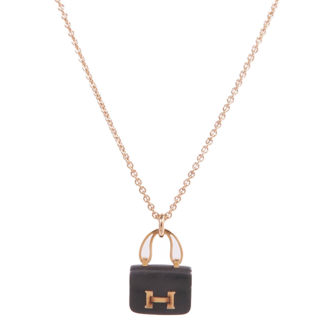 Hermes Amulettes Constance Jade Pendant Necklace in 18K Rose Gold: Hermes Amulettes Constance Jade Pendant Necklace in 18K Rose Gold This Hermes Amulettes Constance necklace features a pendant crafted from 18K pink gold with a jade main stone. The necklace has a regu