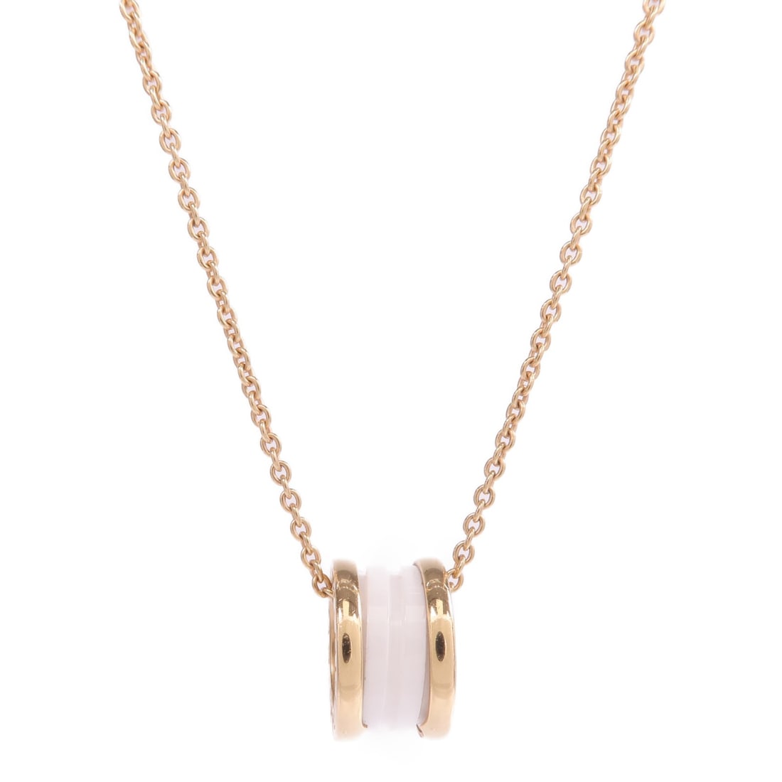 B.Zero 1 18K Rose Gold and White Ceramic Necklace by BVLGARI: B.Zero 1 18K Rose Gold and White Ceramic Necklace by BVLGARI This BVLGARI B.Zero 1 necklace features an 18K pink gold design paired with white ceramic accents. The necklace does not include any stones