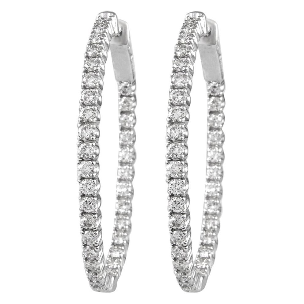 14k White Gold 2.17ct Round Diamond Oval Hoop Earrings: 14k White Gold 2.17ct Round Diamond Oval Hoop Earrings Elevate your elegance with these stunning oval-shaped hoop earrings, featuring a total of 2.17 carats of round brilliant diamonds. Crafted in exq