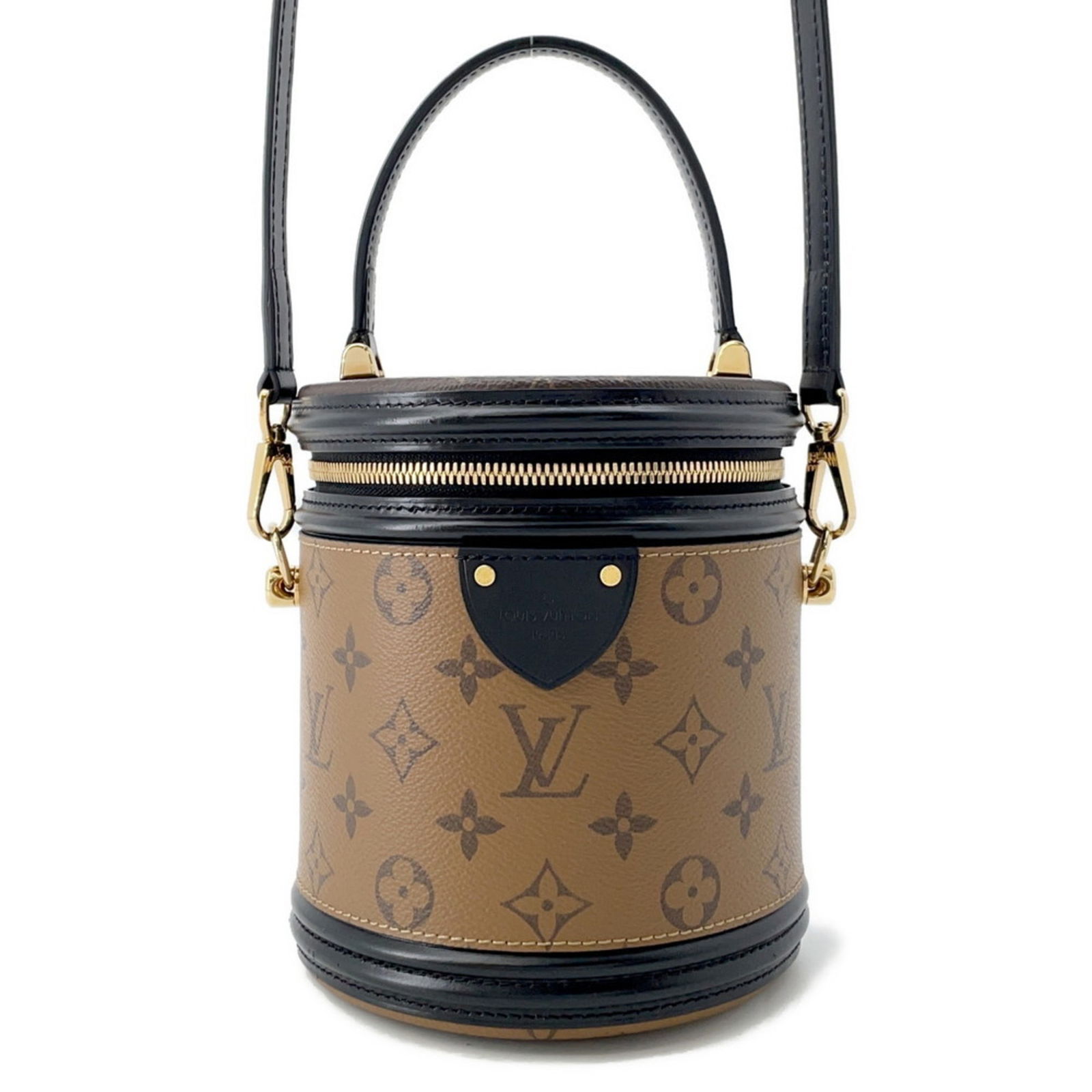 Louis Vuitton Cannes Brown Canvas Handbag with Top Handle: Louis Vuitton Cannes Brown Canvas Handbag with Top Handle The Louis Vuitton Cannes is a stylish women's handbag crafted from brown canvas. It features a compact design with a structured silhouette, of