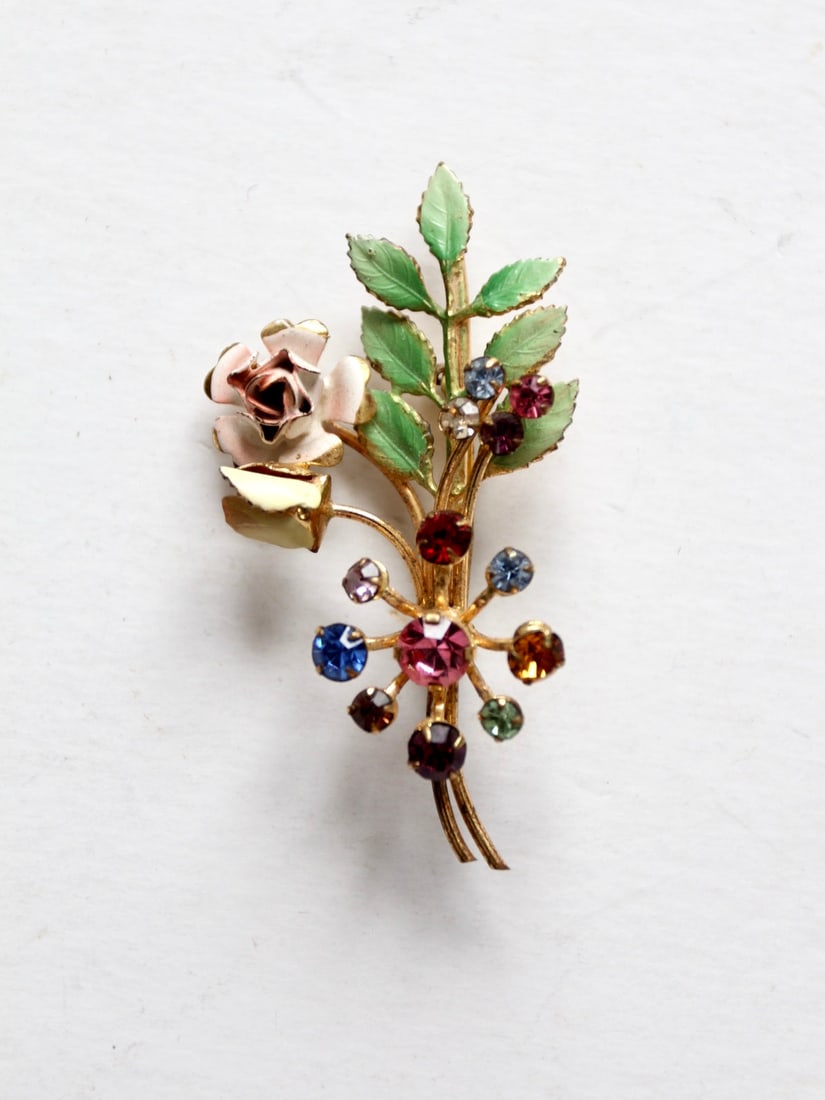 Vintage Austrian Crystal Floral Brooch with Gold Tone and Enamel: Vintage Austrian Crystal Floral Brooch with Gold Tone and Enamel This exquisite vintage Austrian crystal floral brooch features a beautiful arrangement of pastel flowers, elegantly crafted in a gold t