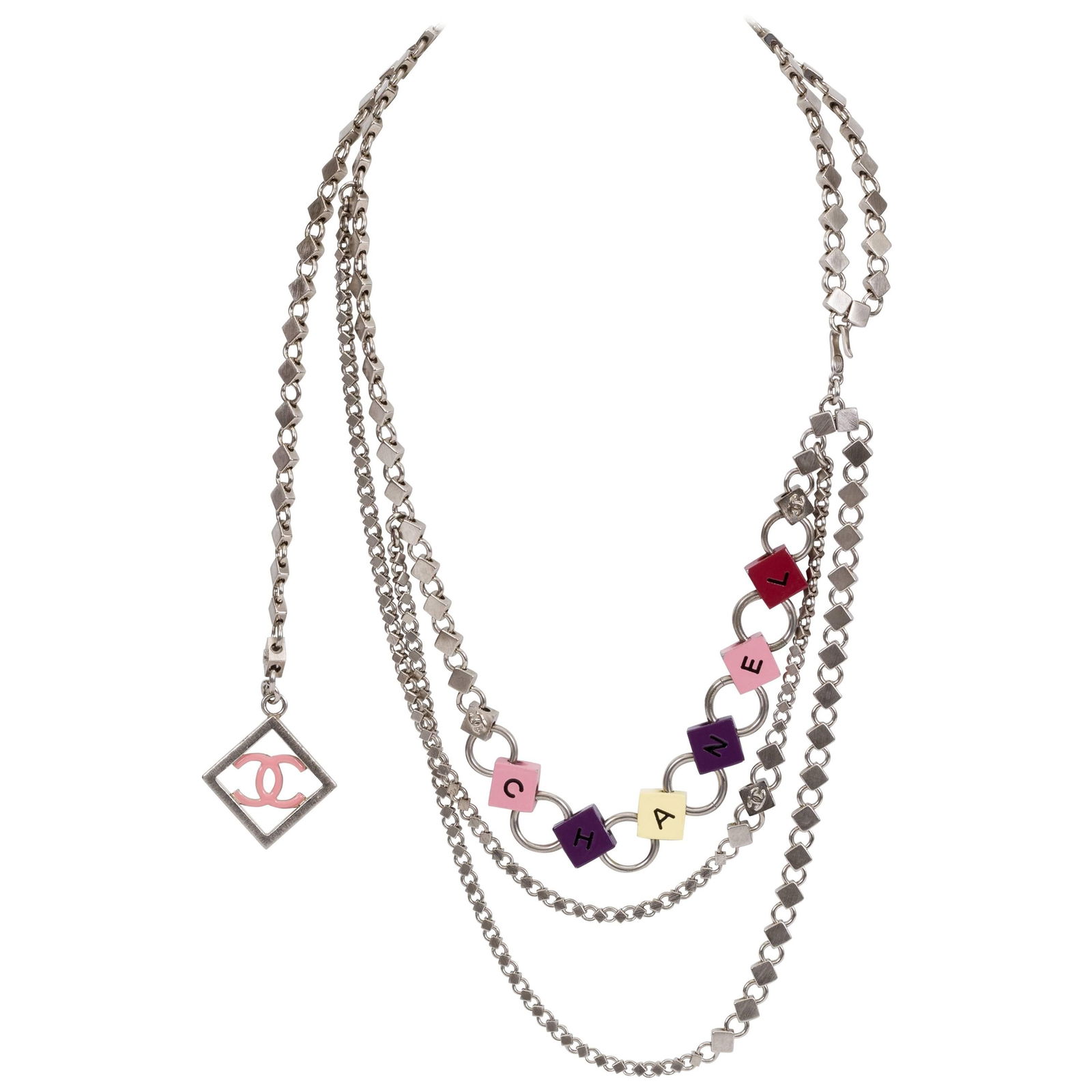 Chanel Spring 04 Silver Tone Triple Charm Belt Necklace: Chanel Spring 04 Silver Tone Triple Charm Belt Necklace This exquisite Chanel triple charm belt necklace features a sleek silver tone brushed metal design adorned with multicolor letters, making it a