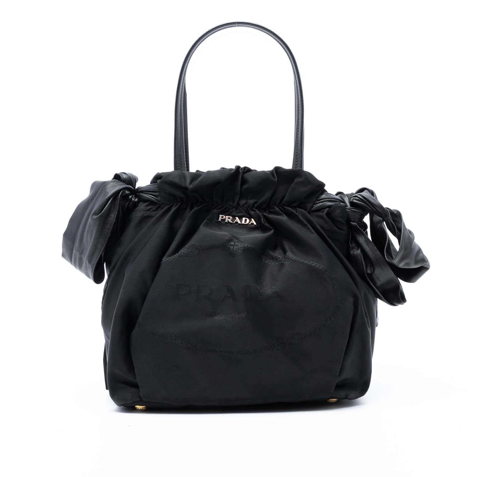 Prada Tessuto Logo Bow Satchel Black Nylon Bag Italy: Prada Tessuto Logo Bow Satchel Black Nylon Bag Italy Introducing the Prada Tessuto Logo Bow Satchel, a stylish and functional accessory crafted from durable nylon. This elegant satchel features flat l
