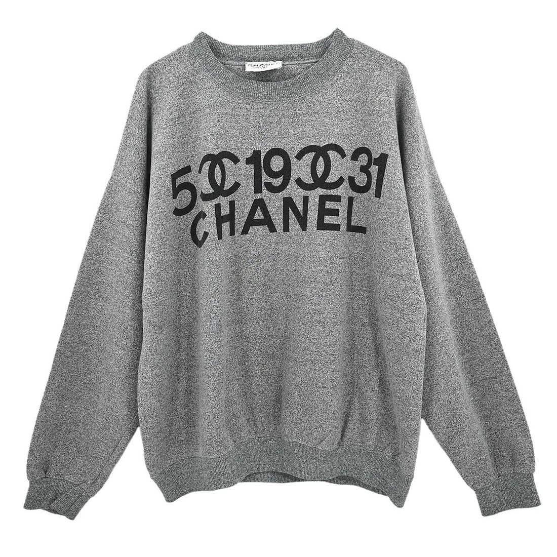 Gray Long Sleeve Chanel Top for Women: Gray Long Sleeve Chanel Top for Women This Chanel long sleeve top features a classic gray color and a regular fit, making it a versatile choice for casual occasions. The sweater is in very good condit