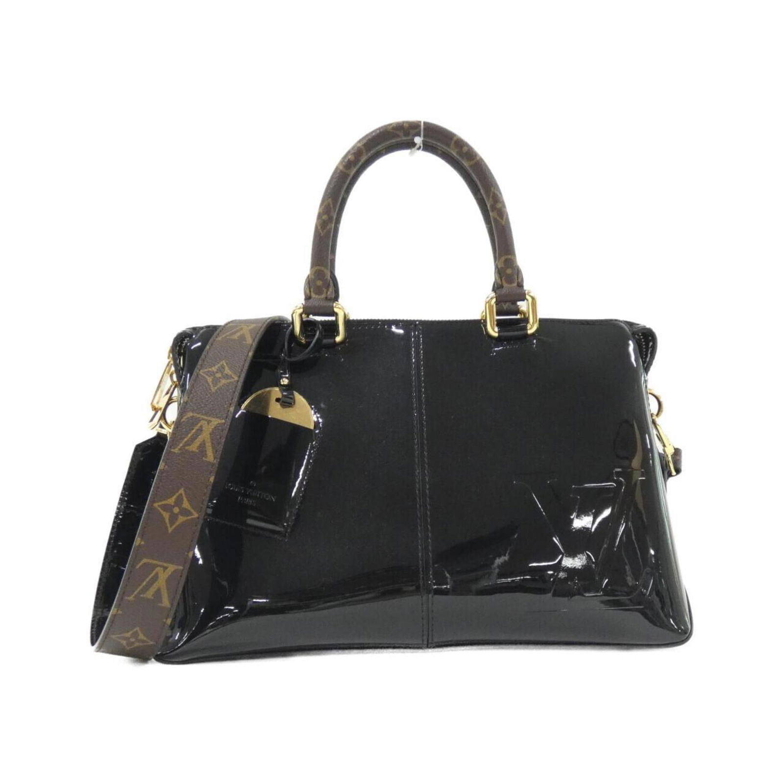 Patent Leather Black Mirror Bag by Louis Vuitton: Patent Leather Black Mirror Bag by Louis Vuitton This Louis Vuitton Mirror bag is crafted from black patent leather and designed for women. Made in France, it features a spacious interior and a sleek