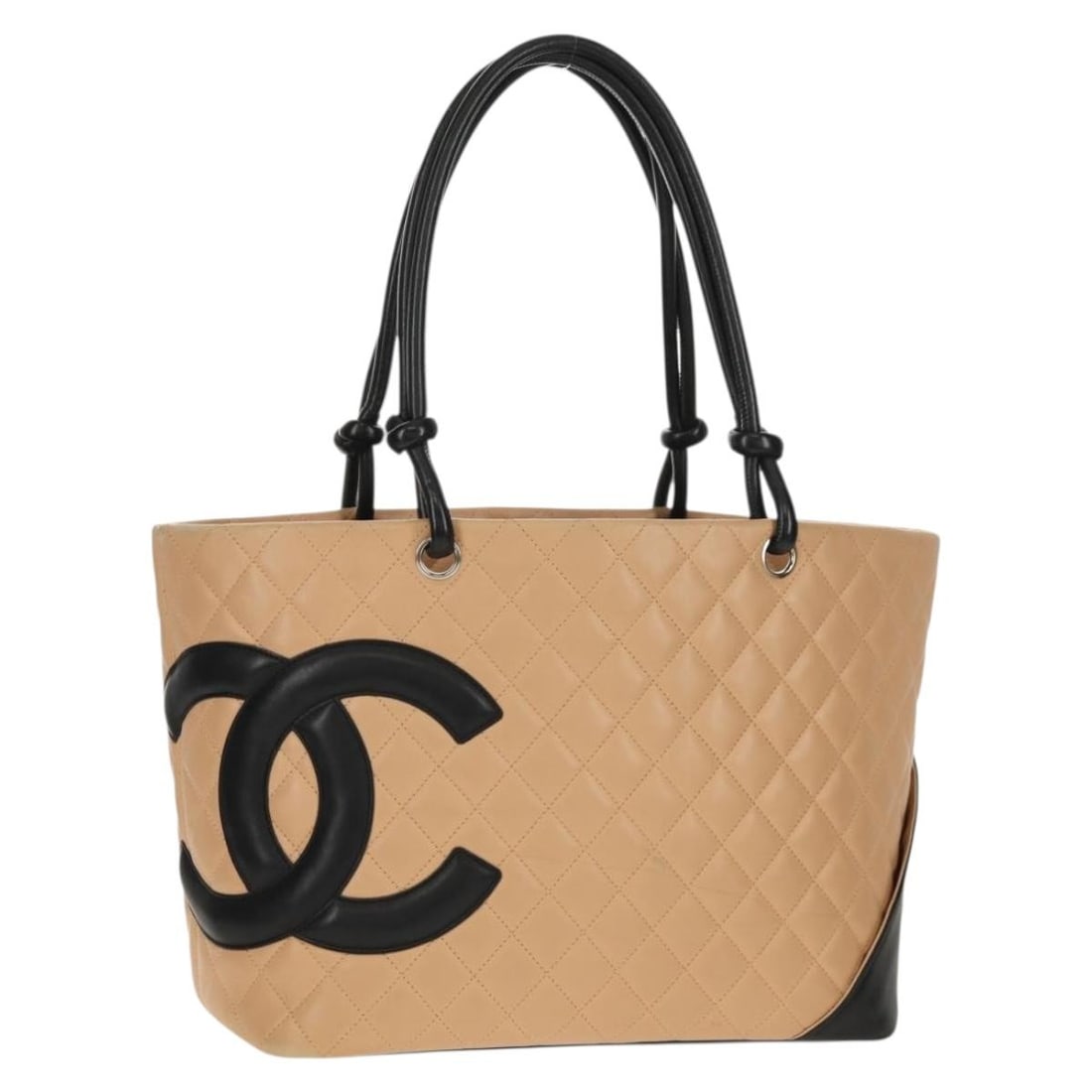Beige Calfskin Cambon Tote by Chanel with Silver CC Hardware: Beige Calfskin Cambon Tote by Chanel with Silver CC Hardware This CHANEL Cambon Line Large Matelasse tote bag is crafted from beige calf leather with silver-tone CC logo detailing. The spacious tote f