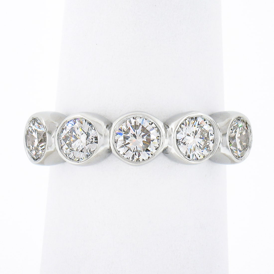 Platinum 1.36ctw Round Bezel 5 Stone Diamond Wedding Band Ring: Platinum 1.36ctw Round Bezel 5 Stone Diamond Wedding Band Ring This exquisite wedding band ring is crafted from solid 950 platinum and showcases five stunning round brilliant cut diamonds, elegantly b