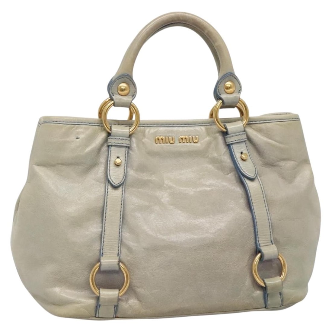 Miu Miu Light Blue Gold Leather Hand Bag Auth 138164: Miu Miu Light Blue Gold Leather Hand Bag Auth 138164 This Miu Miu handbag is a stylish accessory crafted from premium leather in a beautiful light blue and gold color combination. Measuring approximat