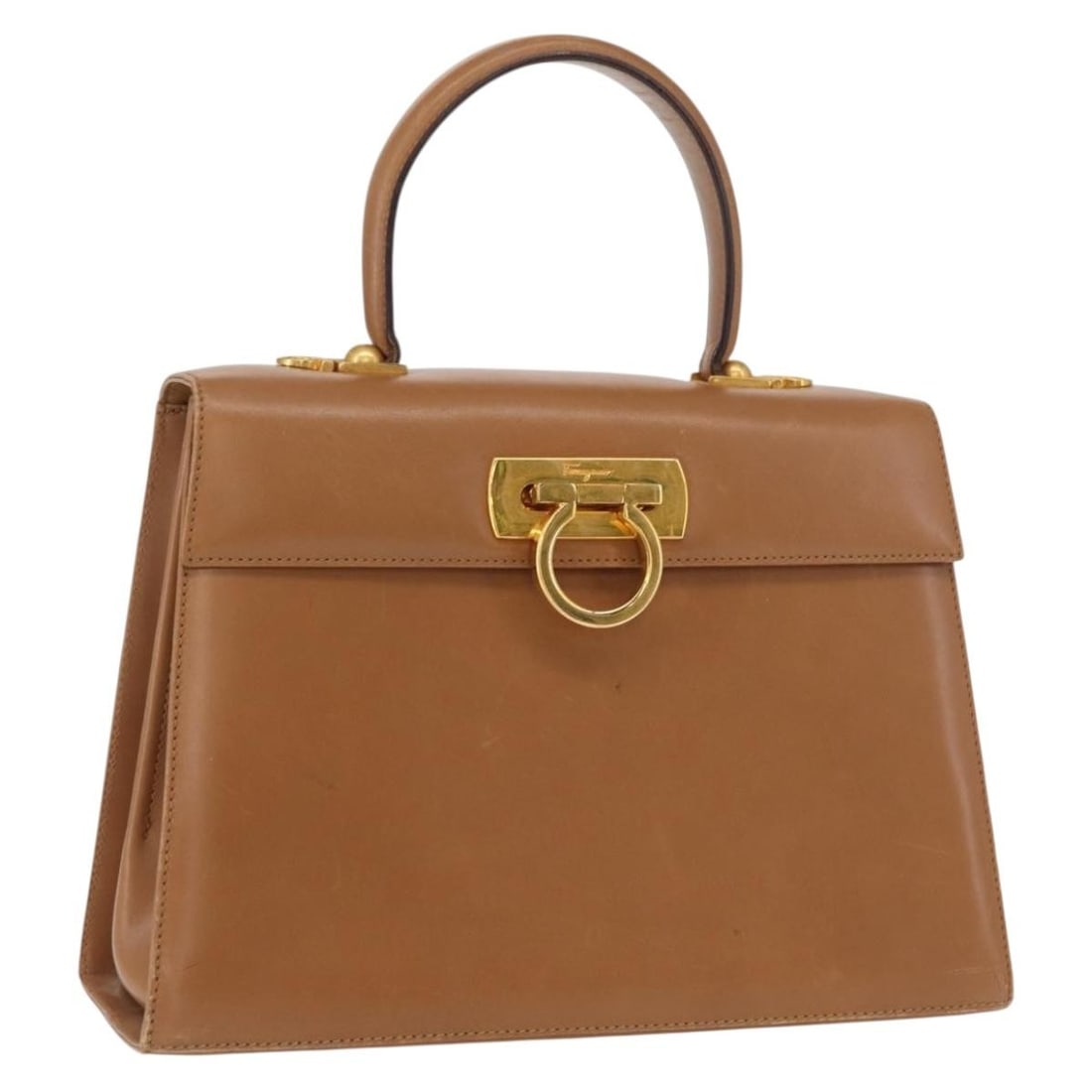Salvatore Ferragamo Gancini Brown Leather Handbag Gold Accents Italian Made: Salvatore Ferragamo Gancini Brown Leather Handbag Gold Accents Italian Made This Salvatore Ferragamo Gancini handbag is crafted from brown leather with gold-tone accents. Made in Italy, the bag featur