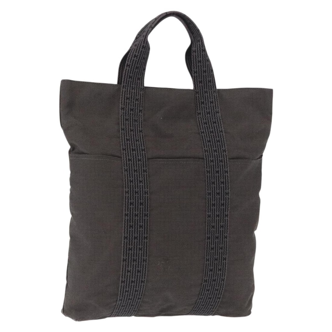 Hermes Her Line Canvas Gray Silver Tote Bag from France: Hermes Her Line Canvas Gray Silver Tote Bag from France This is an un-used Hermes Her Line Kabas tote bag crafted from canvas in gray and silver tones. Made in France, it features a spacious interior