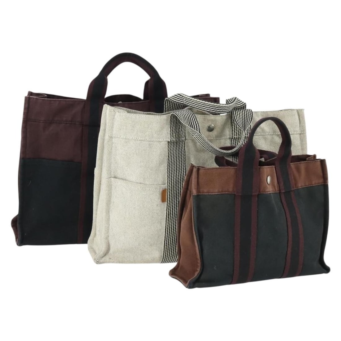 Hermes Fourre Tout Canvas Handbags Set of 3 in Gray Black and Navy: Hermes Fourre Tout Canvas Handbags Set of 3 in Gray Black and Navy This is a set of three HERMES Fourre Tout handbags crafted from cotton canvas in gray, black, and navy. Made in France, the bags exhi