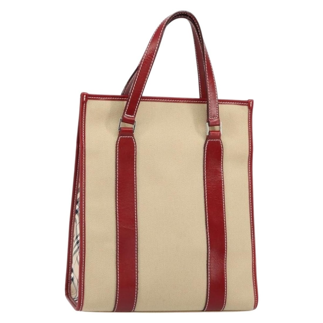 Beige Silver Canvas Blue Label Tote by Burberry Japan: Beige Silver Canvas Blue Label Tote by Burberry Japan This Burberry Blue Label tote bag features a beige and silver canvas exterior. The bag is made in Japan and offers a spacious interior suitable fo