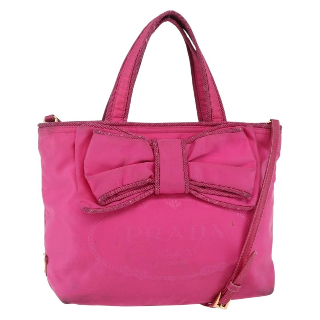 Authentic PRADA Pink Gold Nylon Hand Bag BA6879 Italy: Authentic PRADA Pink Gold Nylon Hand Bag BA6879 Italy This authentic PRADA Hand Bag is crafted from durable nylon, featuring a stylish pink and gold exterior. Ideal for both casual and formal occasion