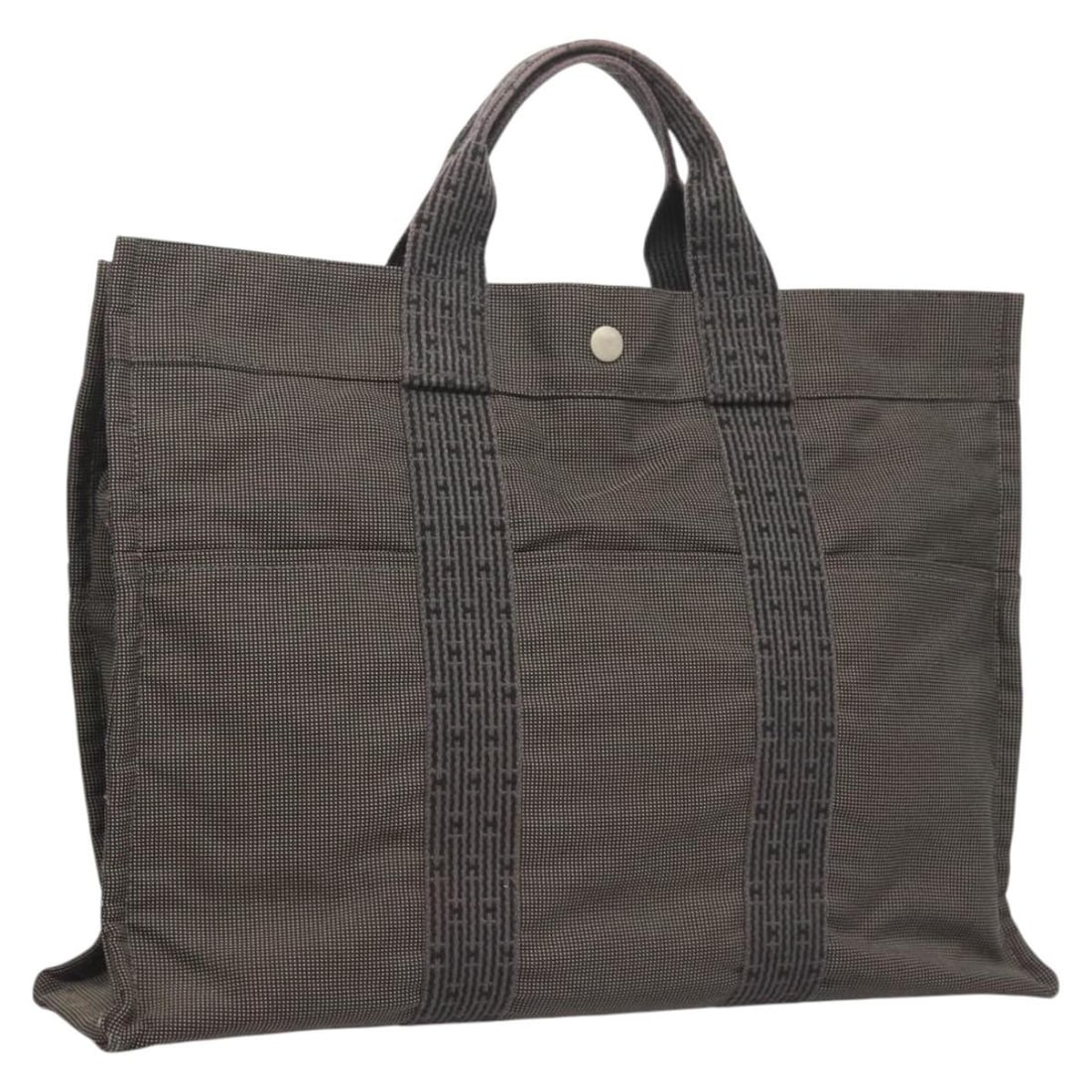 HERMES Her Line MM Hand Bag Gray Canvas Made in France: HERMES Her Line MM Hand Bag Gray Canvas Made in France The HERMES Her Line MM Hand Bag is a stylish and spacious accessory perfect for daily use. Crafted from durable gray canvas, this hand bag featur