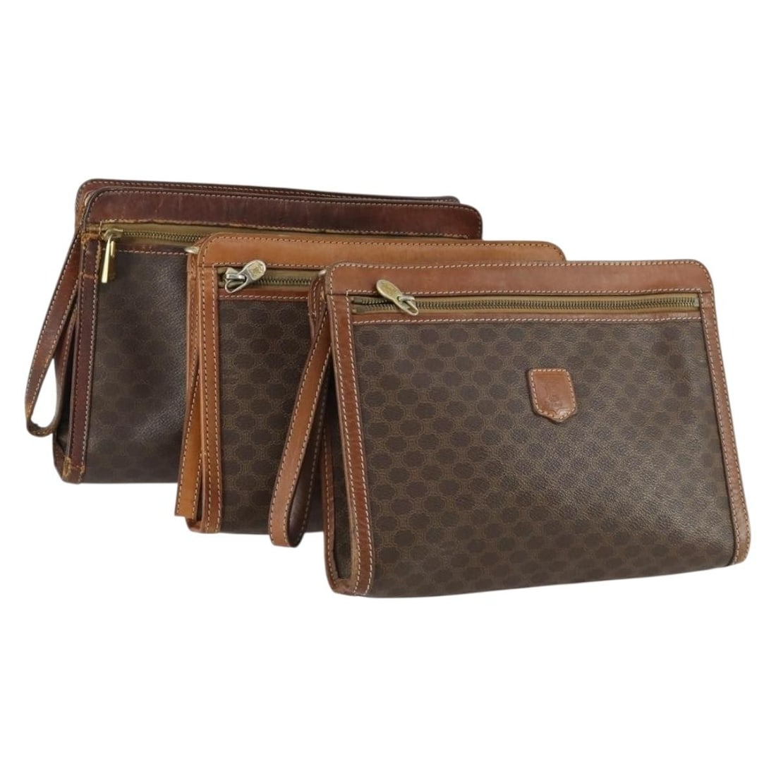 Set of 3 Celine Brown Macadam Canvas and PVC Clutch Bags: Set of 3 Celine Brown Macadam Canvas and PVC Clutch Bags This is a Celine Macadam Canvas clutch bag set, featuring three pieces crafted from brown PVC leather and Macadam canvas. Made in Italy, each c