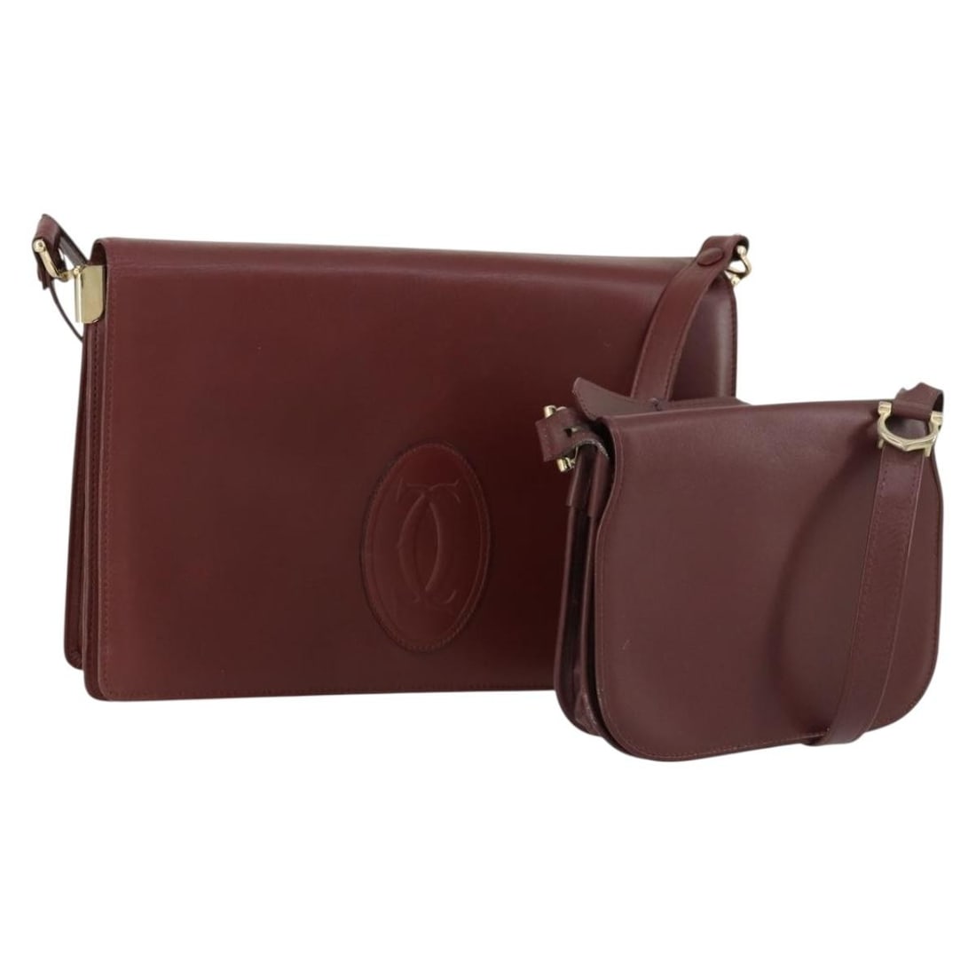 Set of 2 Cartier Must Line Bordeaux Leather Shoulder Bags: Set of 2 Cartier Must Line Bordeaux Leather Shoulder Bags This is a CARTIER Must Line shoulder bag set crafted from Bordeaux leather with gold-tone accents. The set is heavily used, with noticeable si