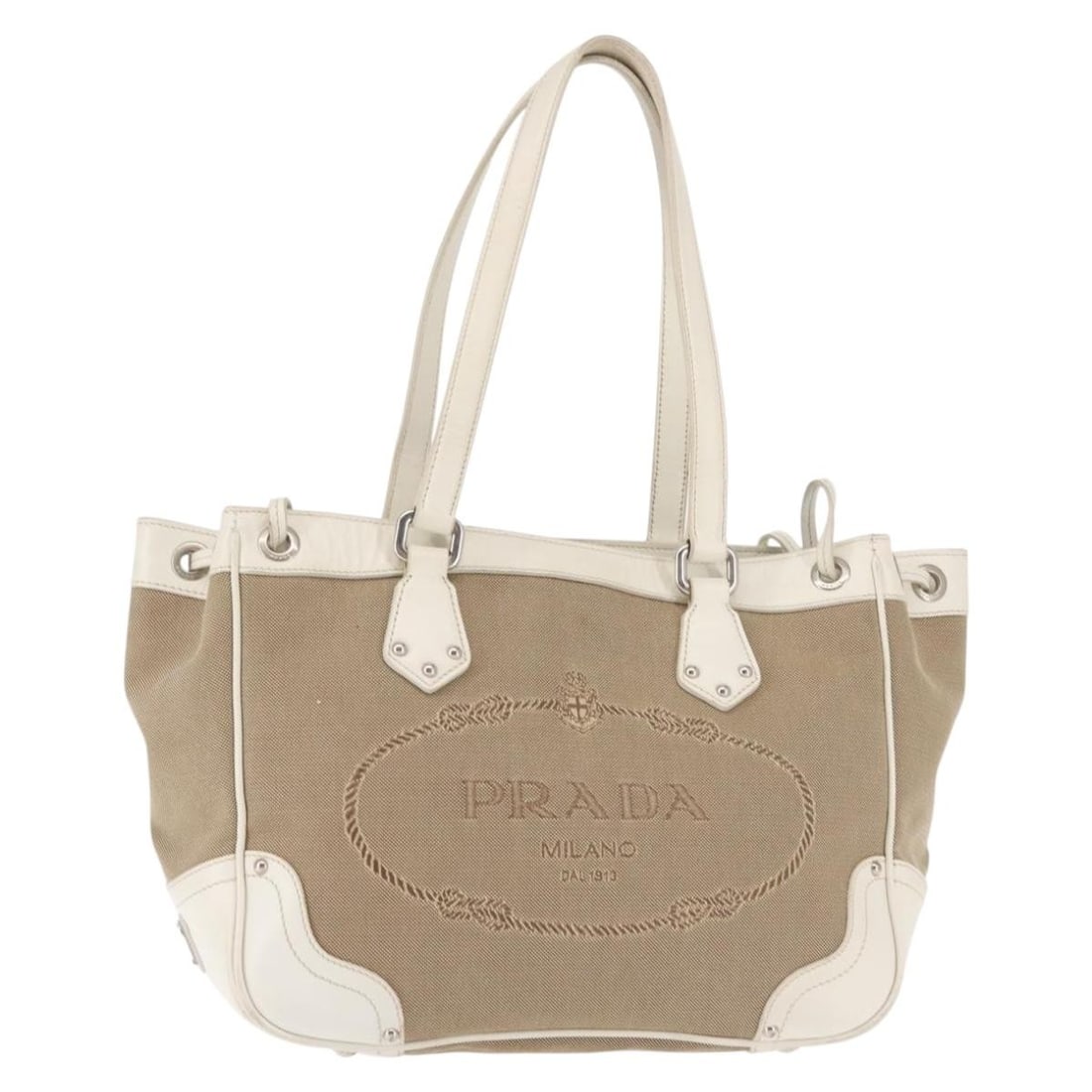 PRADA Beige Silver Canvas Tote Bag Auth 144180 Italy: PRADA Beige Silver Canvas Tote Bag Auth 144180 Italy This stylish PRADA tote bag combines functionality and elegance, featuring a sophisticated beige canvas exterior with silver accents. Designed for