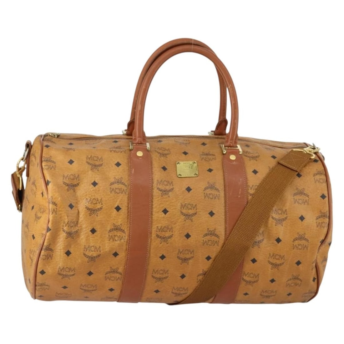 MCM Logogram Vicetos Brown Boston Bag PVC Leather Two Way Germany: MCM Logogram Vicetos Brown Boston Bag PVC Leather Two Way Germany This MCM Logogram Vicetos Boston Bag is crafted from durable PVC leather in brown and gold tones. It features a spacious design with b
