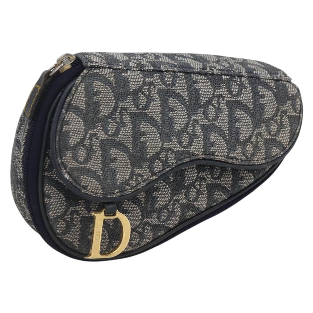 Navy Trotter Canvas Saddle Pouch by Christian Dior Spain: Navy Trotter Canvas Saddle Pouch by Christian Dior Spain This Christian Dior Trotter Canvas Saddle Pouch features a navy and gold color scheme with the signature Trotter canvas material. The pouch is
