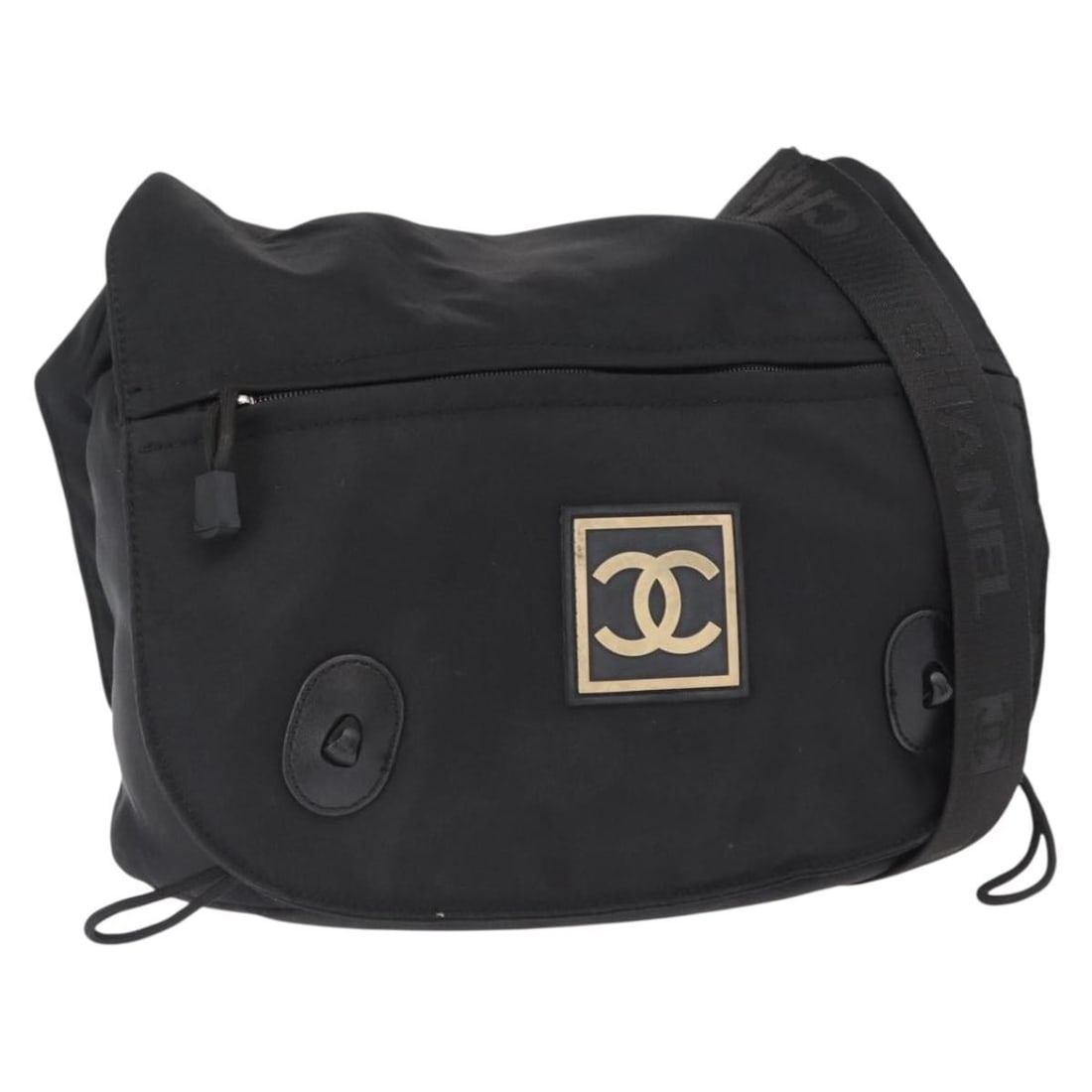 Black Nylon CC Logo Shoulder Bag by CHANEL with Silver Accents: Black Nylon CC Logo Shoulder Bag by CHANEL with Silver Accents This CHANEL shoulder bag is crafted from black nylon with silver-tone accents, featuring the iconic CC logo. Designed for everyday use, i