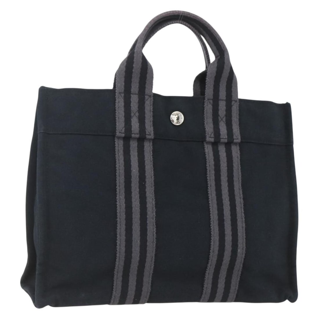 Hermes Fourre Tout PM Black Canvas Handbag Silver Tone Details: Hermes Fourre Tout PM Black Canvas Handbag Silver Tone Details This Hermes Fourre Tout PM hand bag features a black and silver canvas exterior and is crafted in France. The bag is designed with dual t