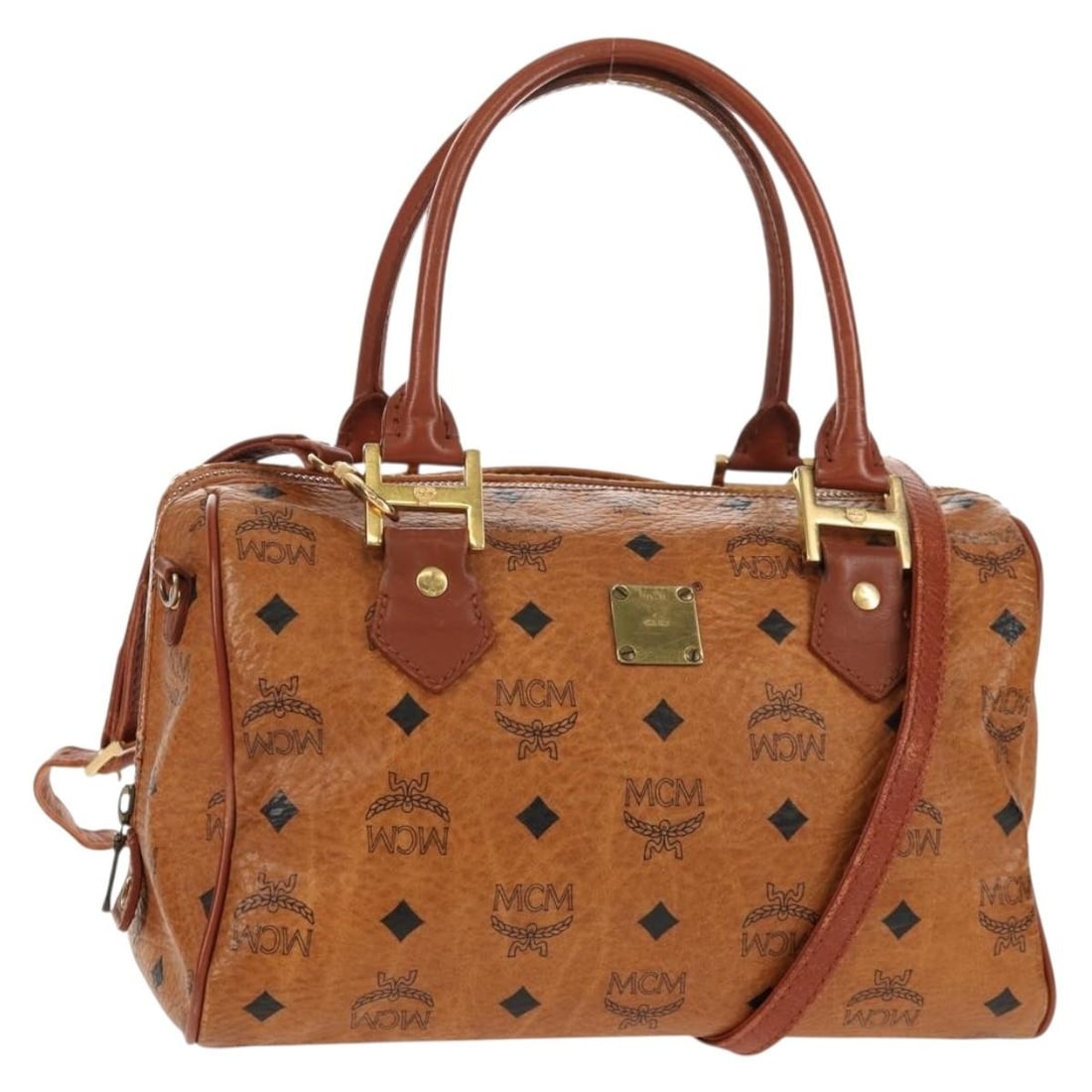 MCM Vicetos Brown PVC Leather Handbag with Shoulder Strap Two Way Design: MCM Vicetos Brown PVC Leather Handbag with Shoulder Strap Two Way Design This MCM Logogram Vicetos handbag features a brown and gold exterior crafted from PVC leather. Designed as a versatile 2-way ba
