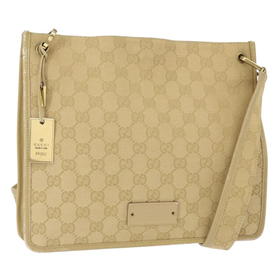Gucci Beige Gold GG Canvas 91762 Shoulder Bag from Italy: Gucci Beige Gold GG Canvas 91762 Shoulder Bag from Italy This is a Gucci GG Canvas shoulder bag in beige and gold, featuring the iconic GG canvas exterior. The bag is crafted in Italy and offers a spa