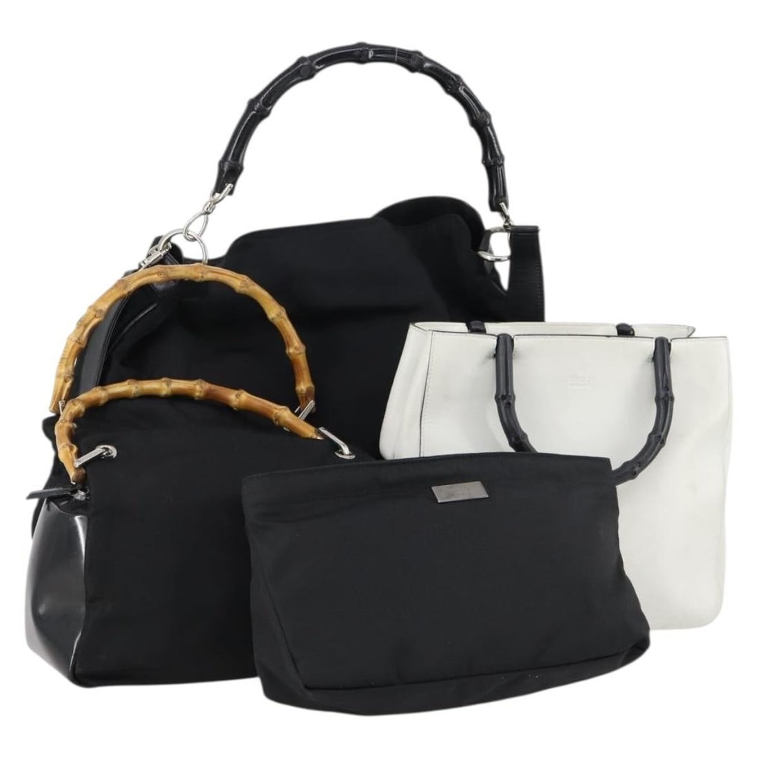 GUCCI Bamboo Hand Bag Set Nylon Leather Black White Auth: GUCCI Bamboo Hand Bag Set Nylon Leather Black White Auth This sophisticated GUCCI Bamboo Hand Bag set features a unique design in a stylish combination of black and white nylon. Crafted in Italy, this