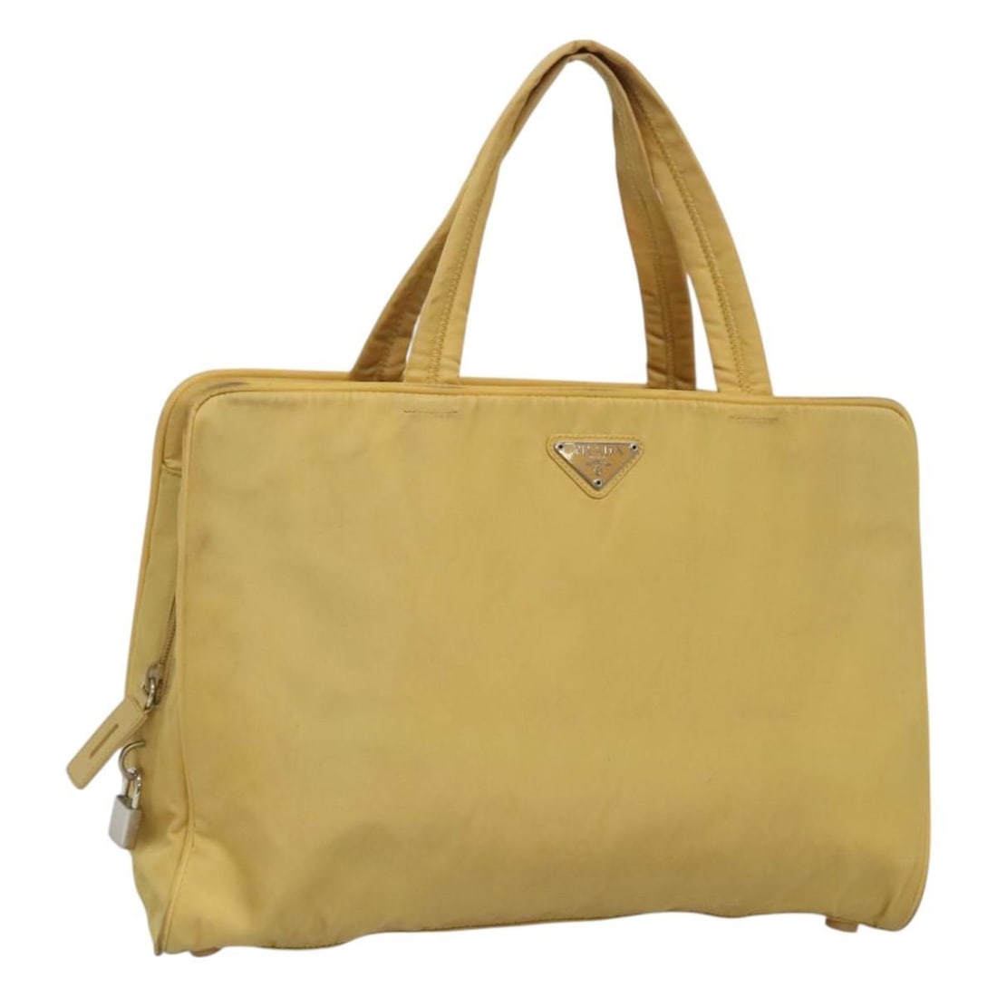 PRADA Yellow Silver Nylon Hand Bag Auth Made in Italy: PRADA Yellow Silver Nylon Hand Bag Auth Made in Italy This PRADA hand bag showcases a vibrant yellow nylon exterior accented with silver details, combining style and functionality. With dimensions of