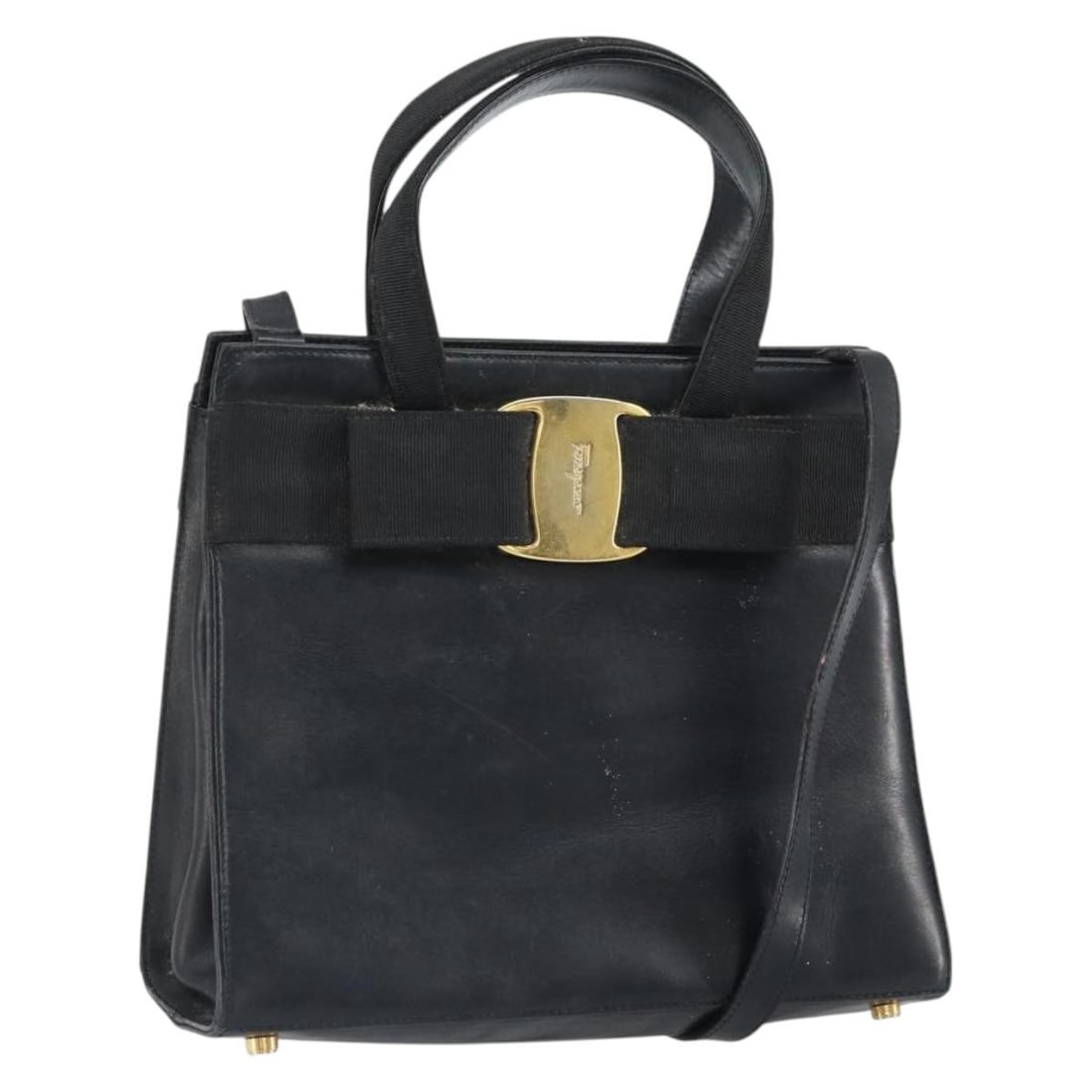 Black Leather Vala Shoulder and Handbag by Salvatore Ferragamo with Gold Accents: Black Leather Vala Shoulder and Handbag by Salvatore Ferragamo with Gold Accents This Salvatore Ferragamo Vala 2-way handbag features black leather with gold-tone accents. The bag includes both a top
