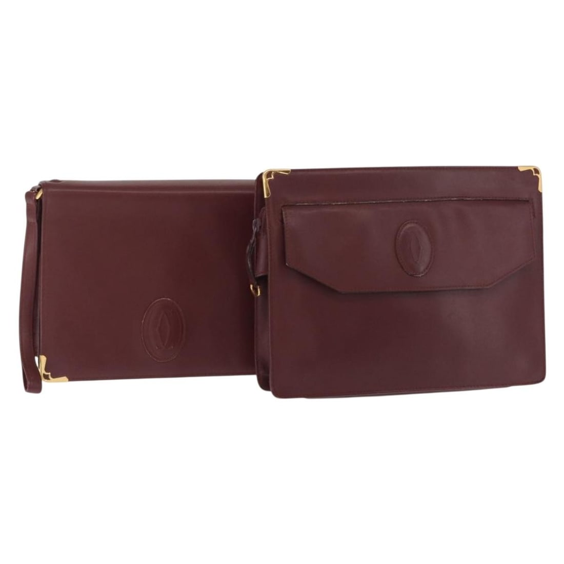 CARTIER Must Line Bordeaux Leather Clutch Bag Set of 2: CARTIER Must Line Bordeaux Leather Clutch Bag Set of 2 This elegant CARTIER Must Line Clutch Bag is crafted from luxurious Bordeaux leather, showcasing a classic design perfect for any occasion. The c