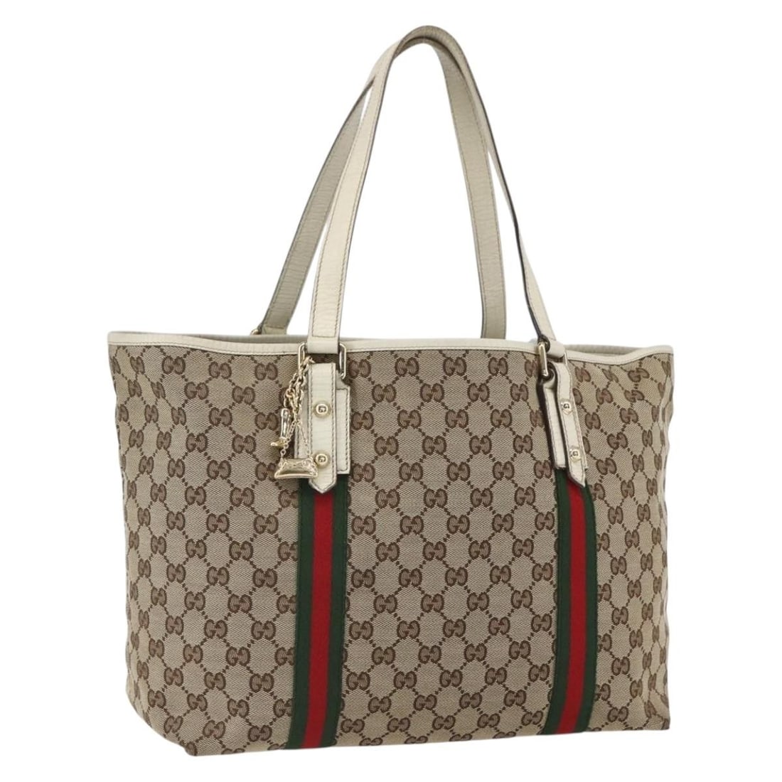 Gucci GG Canvas Beige Gold Tote with Sherry Web Line 139260: Gucci GG Canvas Beige Gold Tote with Sherry Web Line 139260 This GUCCI GG Canvas Web Sherry Line tote bag features a beige and gold exterior crafted from signature GG canvas. The bag includes a charm
